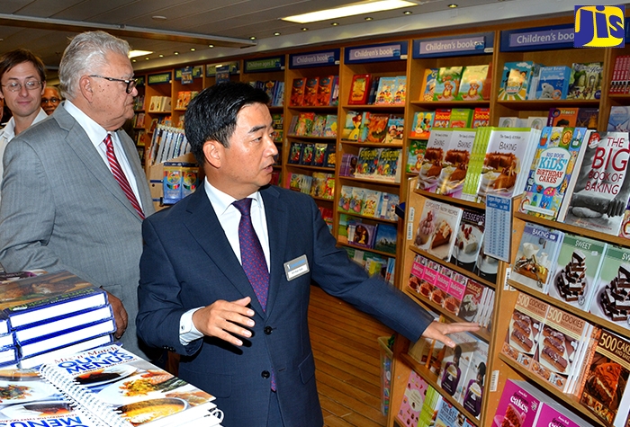 Minister with responsibility for the Ministry of Education, Youth and Information, Hon. Karl Samuda (left), is being guided by Ship Director, Logos Hope, Pil-hun Park, during a tour of the floating book fair on Thursday (February 27), at the Carib Cement port in Kingston. The book fair will be open from February 27 to March 17.