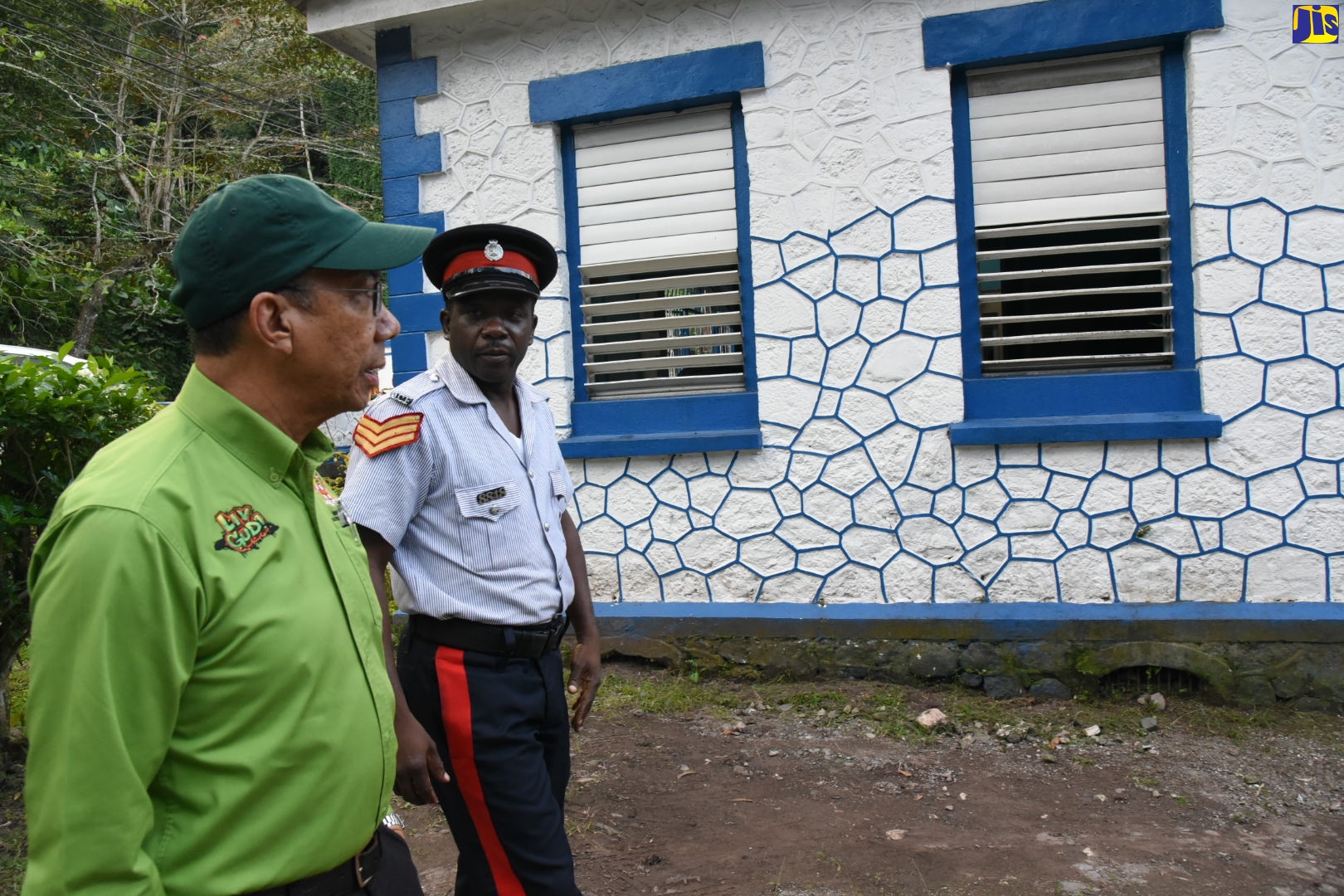 Minister of National Security, Hon. Dr. Horace Chang (left), tours the new barracks at Castleton Police Station, guided by Sergeant Eloy Fletcher, on February 7. 