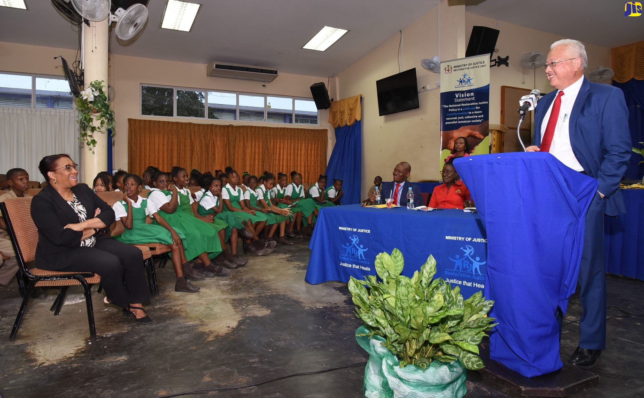 Justice Minister, Hon. Delroy Chuck addressing students and teachers at the Restorative Justice youth forum and panel discussion held on Wednesday (February 5) at the Pembroke Hall Primary School auditorium in Kingston.