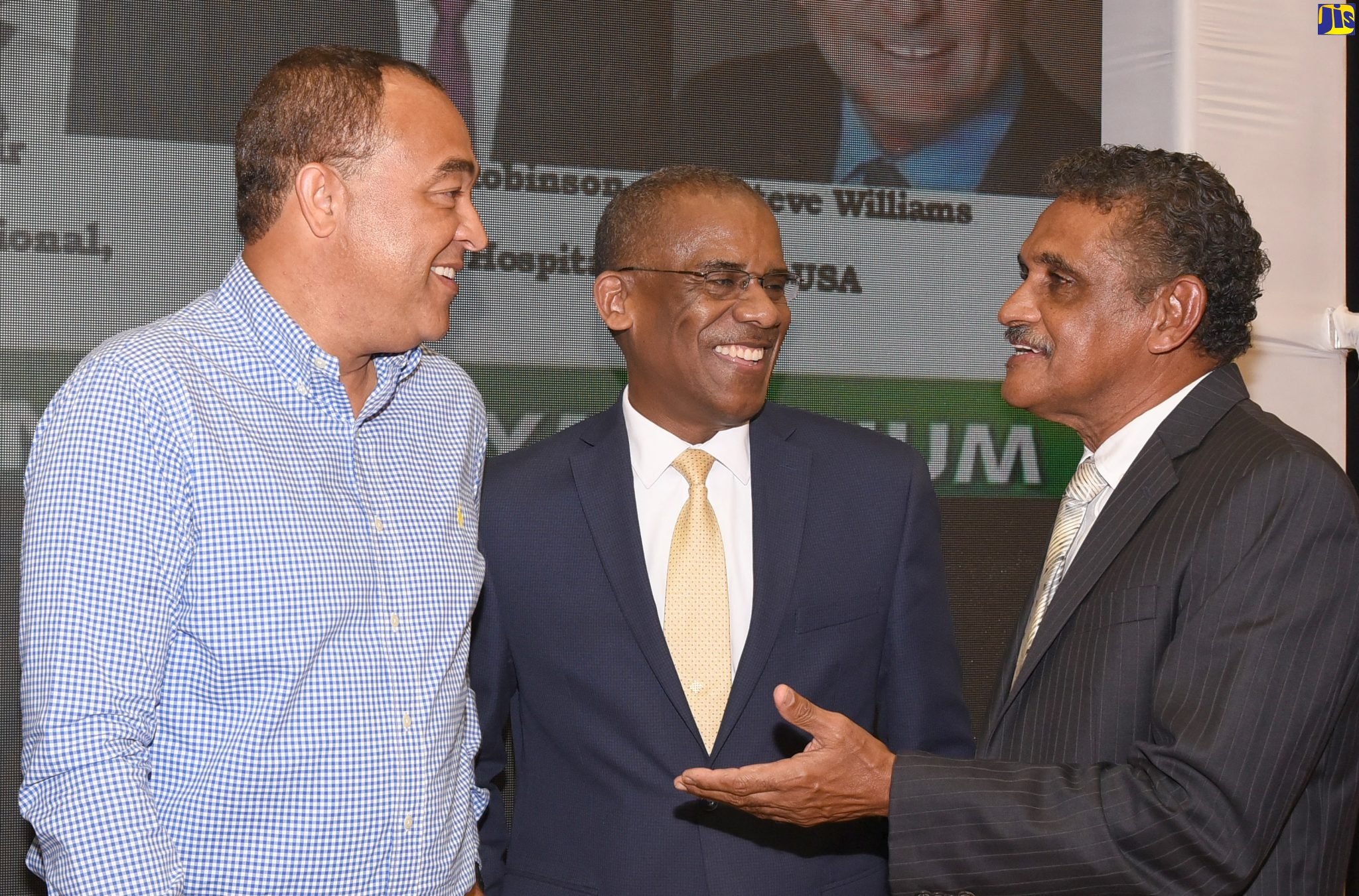 Minister of Health and Wellness, Dr. the Hon. Christopher Tufton (left) shares in conversation with Dean of the Faculty of Medical Sciences, University of the West Indies (UWI), Mona Campus, Dr. Tomlin Paul (centre) and Plastic Surgeon, Dr. Guyan Arscott at the 18th annual Caribbean Neurosciences Symposium held on February 22 at the UWI Mona Campus in Kingston.