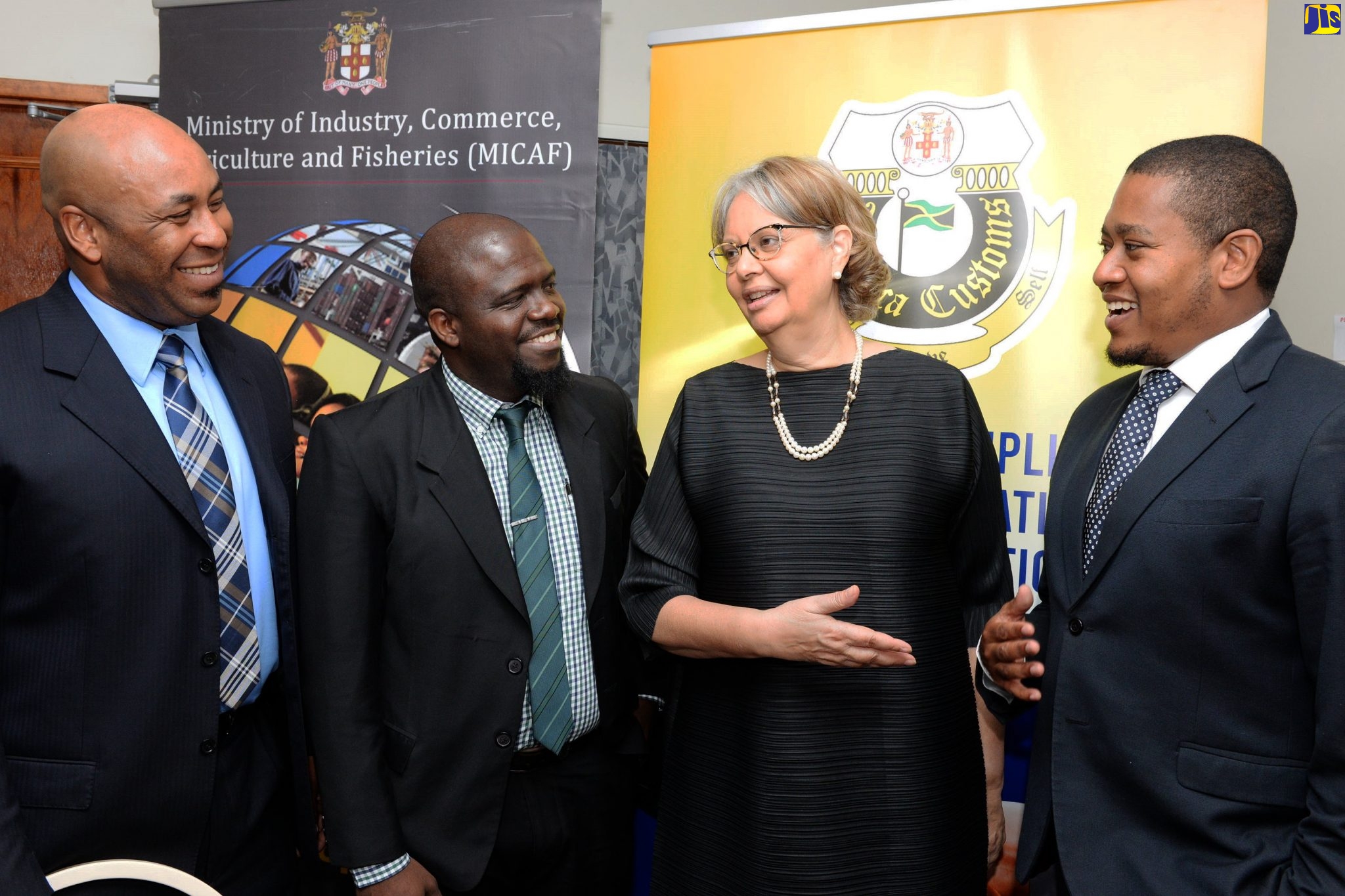 Minister of State in the Ministry of Industry, Commerce, Agriculture and Fisheries, Hon. Floyd Green (right), shares in conversation with (from left) Chief Information Officer at the Jamaica Customs Agency, André Williams; Director of Planning and Research, Jamaica Customs Agency (JCA), Earl Stewart; and Chairman, Trade Facilitation Task Force, Patricia Francis. Occasion was a private-sector-engagement breakfast held on February 27 at the Ministry of Finance and the Public Service, Kingston.