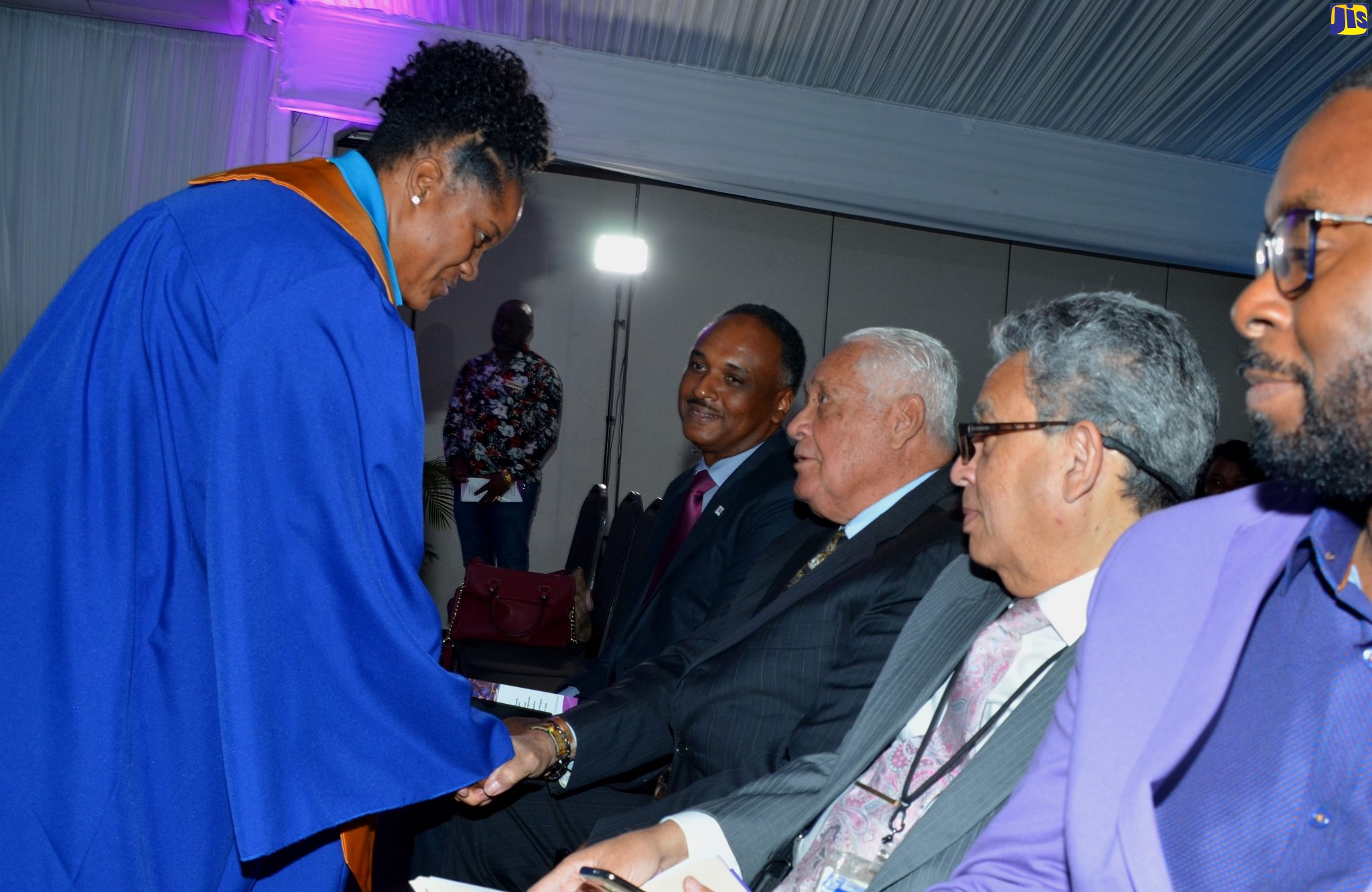 Minister without Portfolio in the Office of the Prime Minister, Hon. Michael Henry (3rd left) congratulates Valedictorian, Denese Austin (left), during the graduation ceremony for the Jamaica Social Investment Fund’s (JSIF) Alternative Livelihood Skills Programme (ALSP), at the Spanish Court Hotel in New Kingston on February 25. Others (from 2nd left) are: Managing Director, JSIF, Omar Sweeney; Advisor to Minister Henry, Bindley Sangster; and Social Services Manager, JSIF, Gresford Bennett.