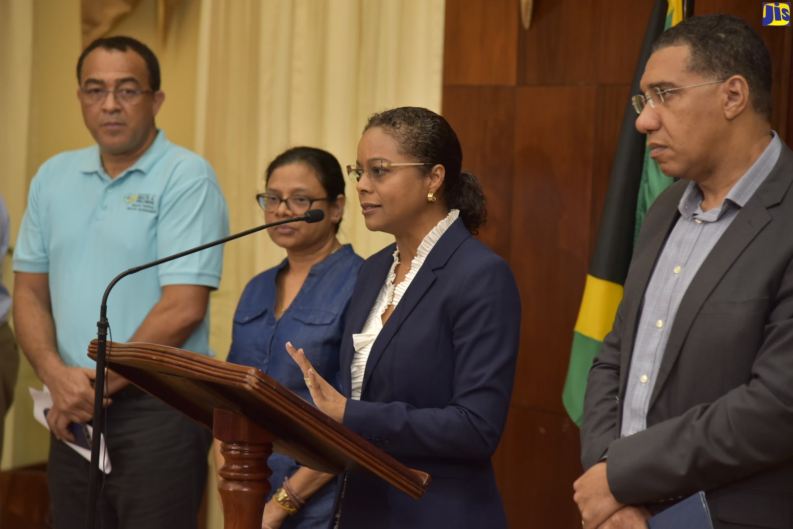 Prime Minister, the Most Hon. Andrew Holness (right), listens as Attorney-General, Hon. Marlene Malahoo Forte (2nd right), speaks at a press briefing on Friday (March 13), at the Office of the Prime Minister in Kingston.  Looking on (from left) are: Minister of Health and Wellness, Dr. the Hon. Christopher Tufton; and Chief Medical Officer, Dr. Jacquiline Bisasor-McKenzie.