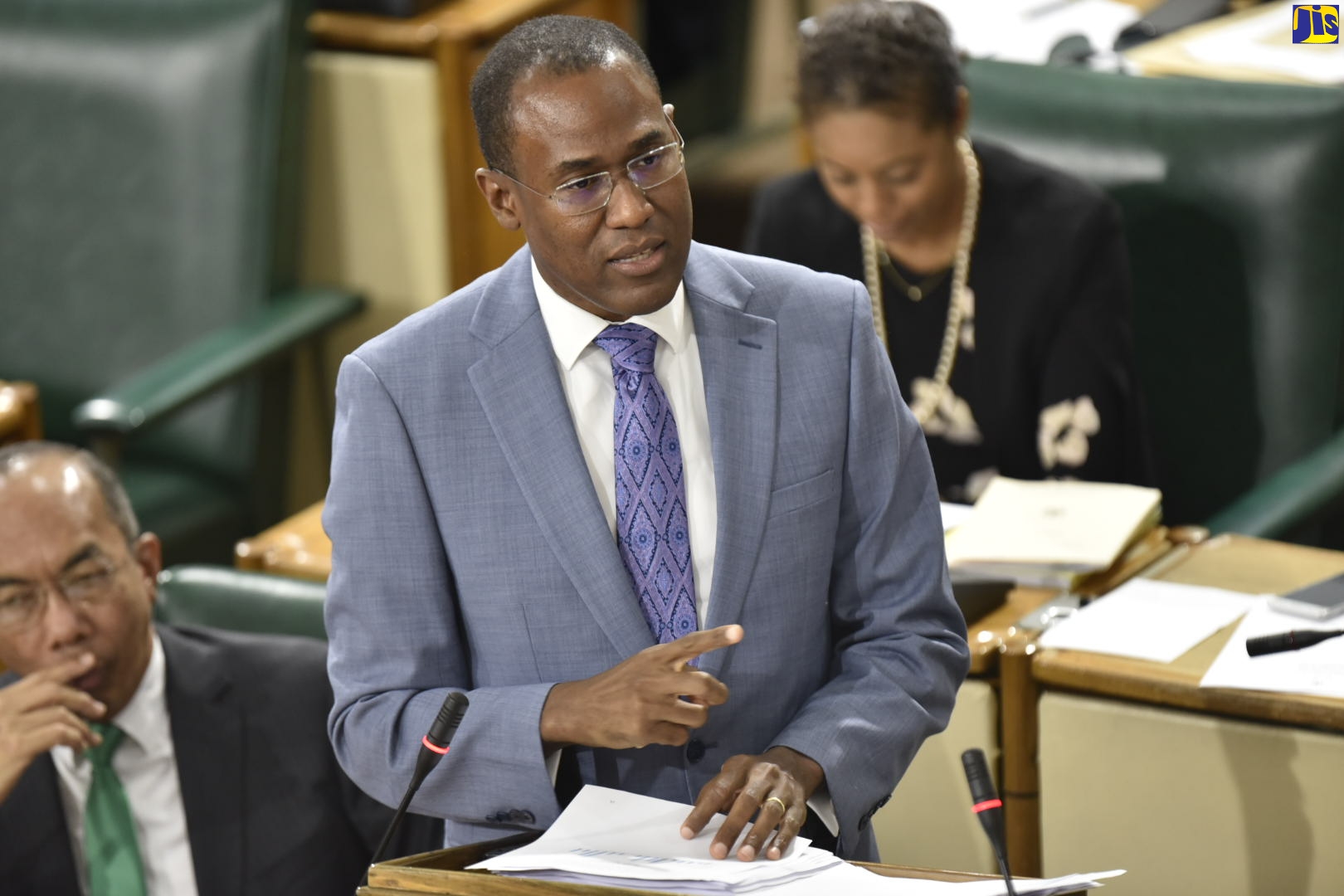 Minister of Finance and the Public Service, Dr. the Hon. Nigel Clarke,  opens the 2020/21 Budget debate in the House of Representatives on March 10. At left is National Security Minister, Hon. Dr. Horace Chang, while Attorney General, Hon. Marlene Malahoo Forte is in the background.