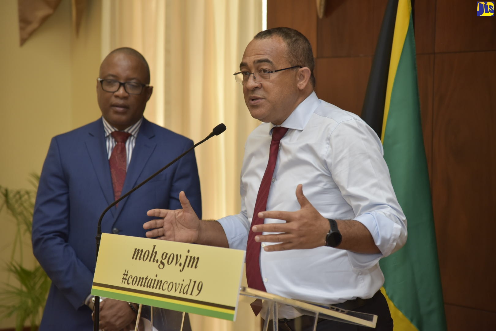 Minister of Health and Wellness, Dr. the Hon. Christopher Tufton (right), provides an update on developments relating to the Coronavirus Disease 2019 (COVID-19), during a media briefing at Jamaica House on Tuesday (March 17). Listening is Permanent Secretary in the Ministry of Health and Wellness, Dunstan Bryan.