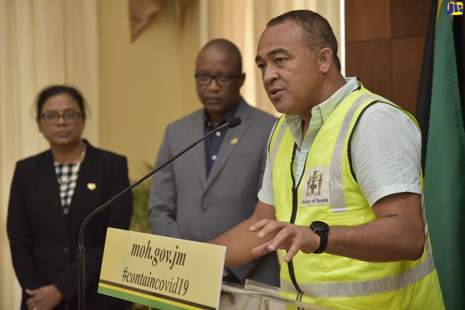 Minister of Health and Wellness, Dr. the Hon. Christopher Tufton, addresses a press conference at Jamaica House on Wednesday (March 18). Listening (from left) are Chief Medical Offiicer, Dr.Jacquiline Bisasor McKenzie; and Permanent Secretary in the Ministry, Dunstan Bryan.