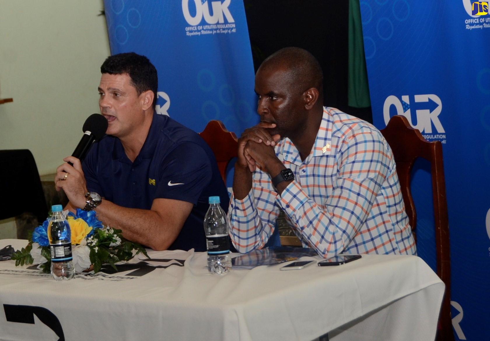 President and Chief Executive Officer of Jamaica Public Service (JPS) Company, Emanuel DaRosa (left), fields questions from residents during the Office of Utilities Regulation’s (OUR) Public Consultation on the JPS’s 2019-2024 tariff review, which was held at the Sharon Baptist Church in Santa Cruz, St. Elizabeth, on Tuesday (March 10). Beside him is Chief Financial Officer (CFO) at the JPS, Vernon Douglas.