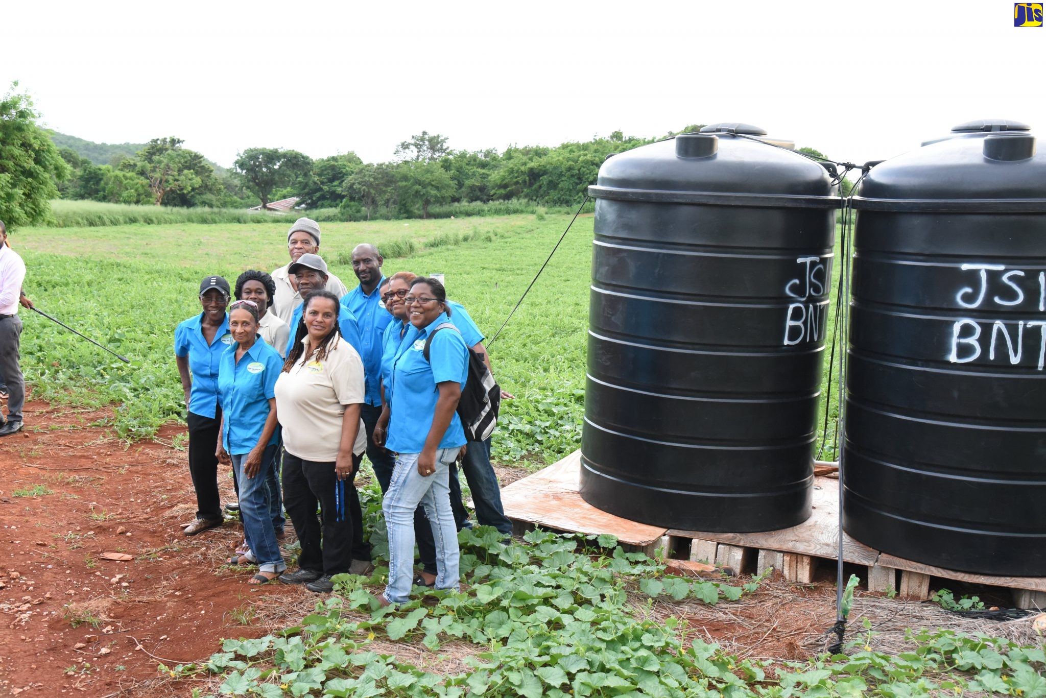 Members of the Farm Group in South Field, St. Elizabeth, showcase the Irrigation equipment given to the group by the Caribbean Development Bank.