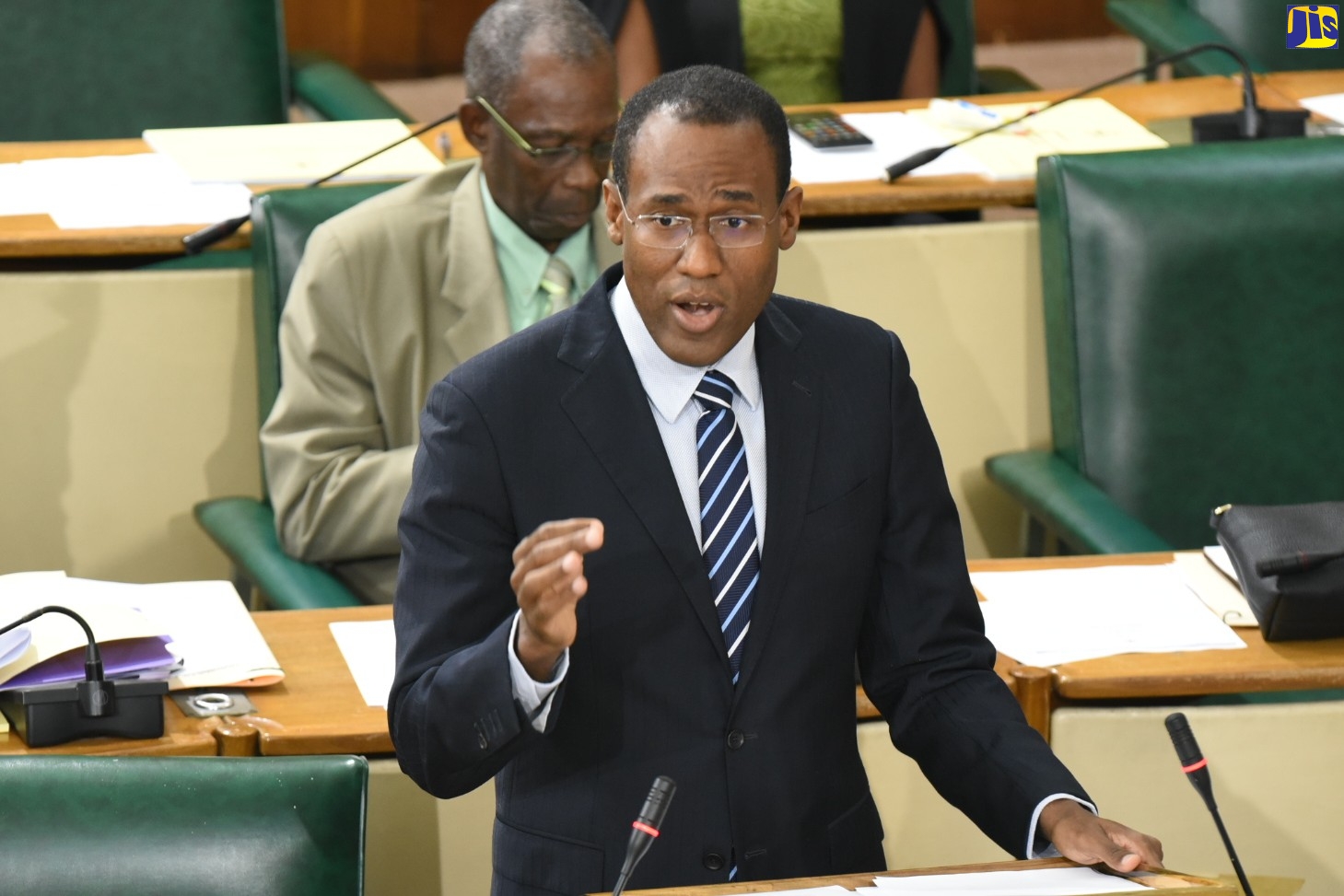 Minister of Finance and the Public Service, Dr. the Hon. Nigel Clarke, emphasises a point while closing the 2020/21 Budget Debate in the House of Representatives on March 24. In the background is Minister without portfolio for Industry, Commerce, Agriculture and Fisheries, Hon. J.C. Hutchinson.