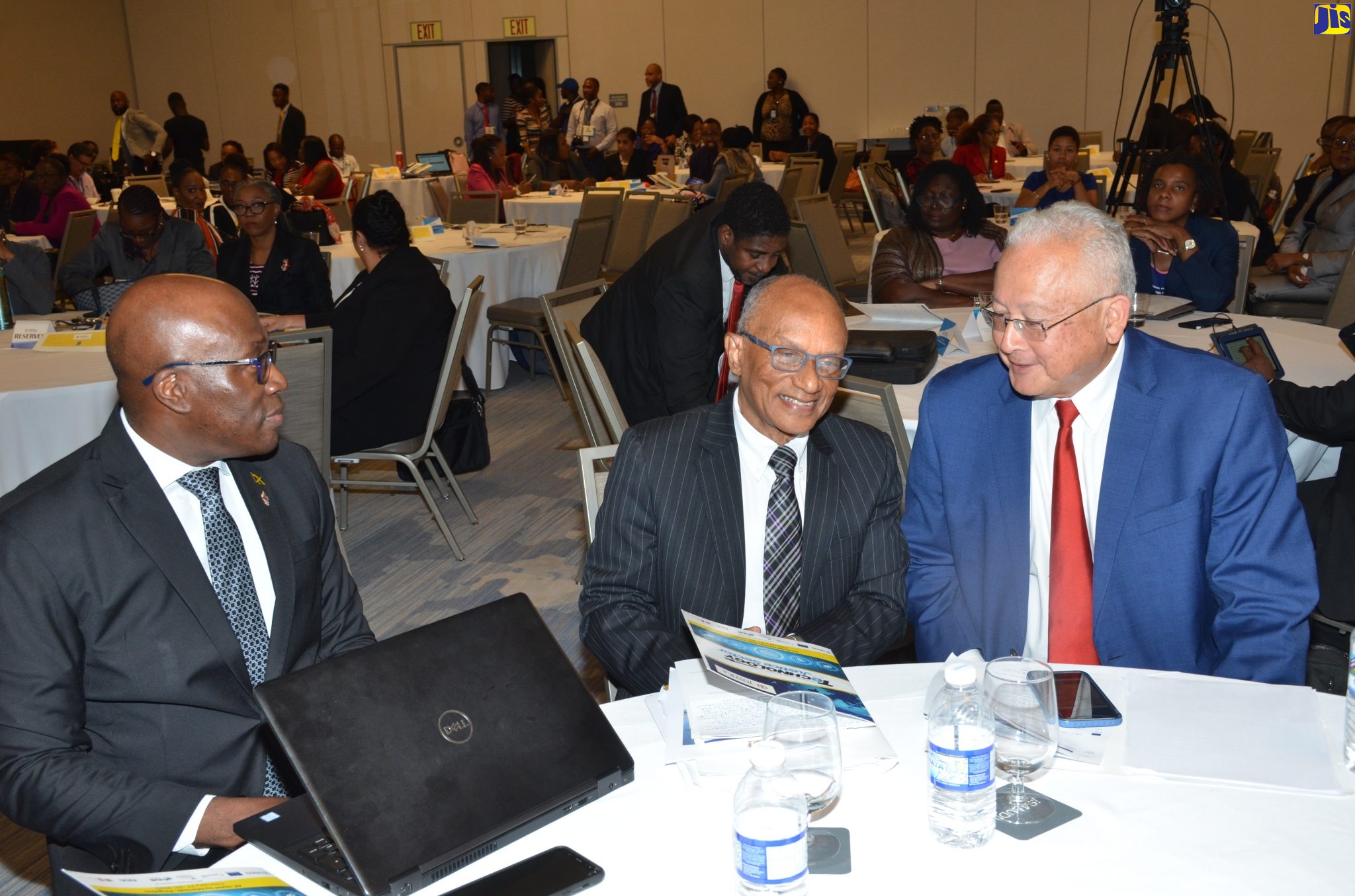 Justice Minister, Hon. Delroy Chuck  (right), in discussion with Executive Director of the National Integrity Action (NIA), Trevor Munroe, at the launch of the National Conference on Technology in the Justice Sector, at the AC Marriot Hotel in Kingston.  At left is Chief Justice, Bryan Sykes.