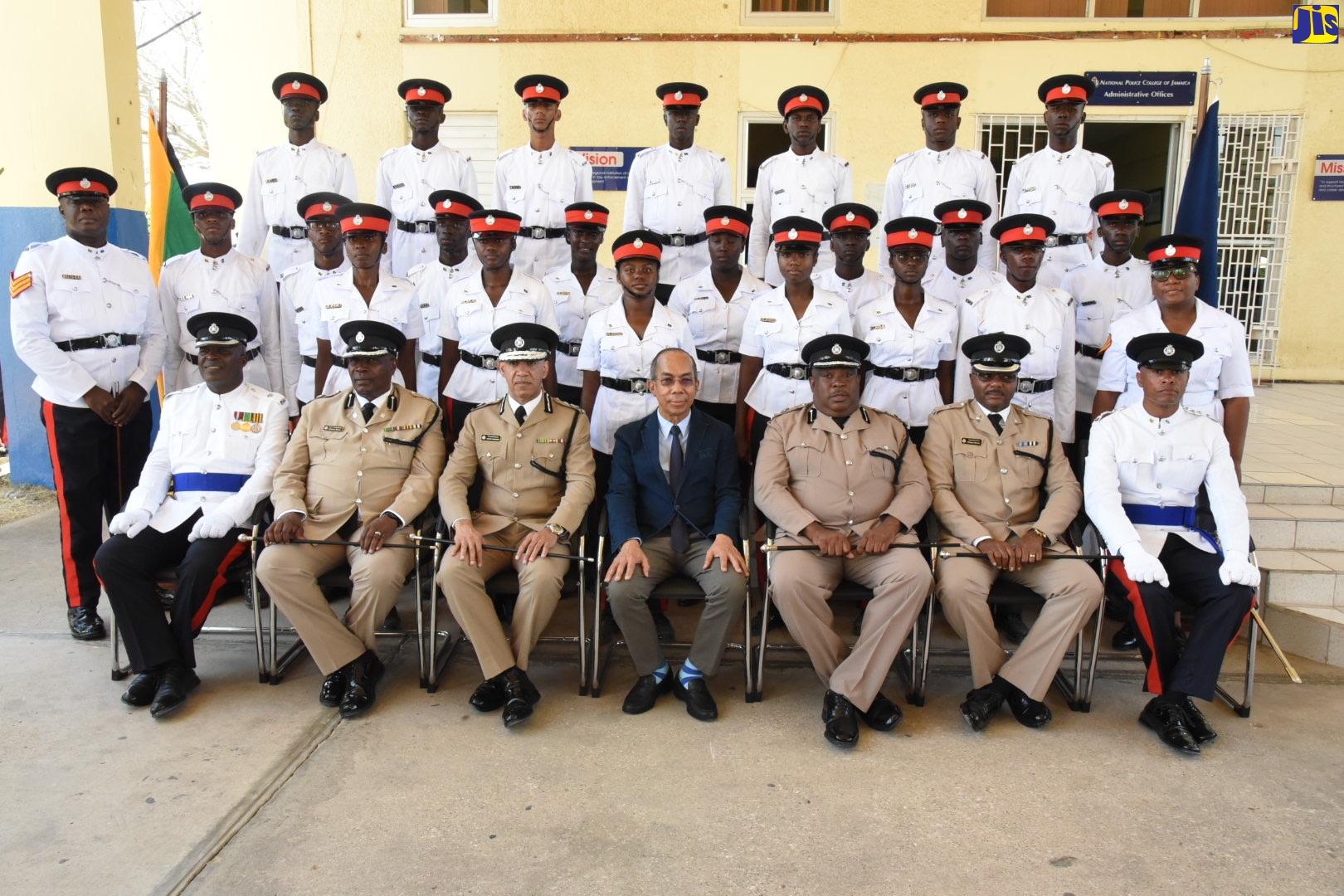 National Security Minister,  Hon. Dr. Horace Chang (centre, seated);  Commissioner of Police, Major General Antony Anderson (third left), and other Senior Officers of the Jamaica Constabulary Force (JCF), with a  batch of new Constables at a passing out parade and awards ceremony, held at the National Police College of Jamaica (NPCJ) in St. Catherine, on Thursday (March 5). A total of 332 new constables graduated from the NPCJ.
