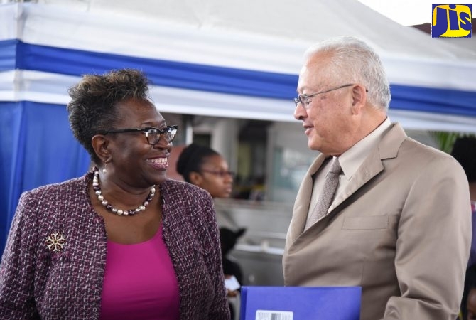 Justice Minister, Hon. Delroy Chuck (right), speaks with Director of Public Prosecution (DPP), Paula Llewellyn. (FILE)