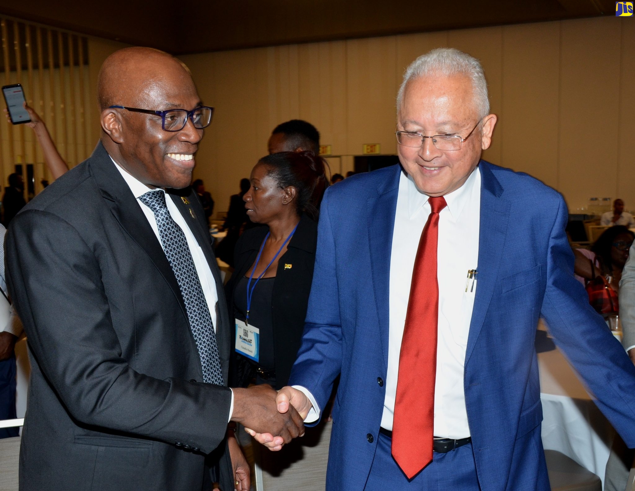Justice Minister, Hon. Delroy Chuck (right), greets Chief Justice, Hon. Bryan Sykes, during the recent National Conference for Technology in the Justice Sector, at the AC Marriott Hotel in Kingston.