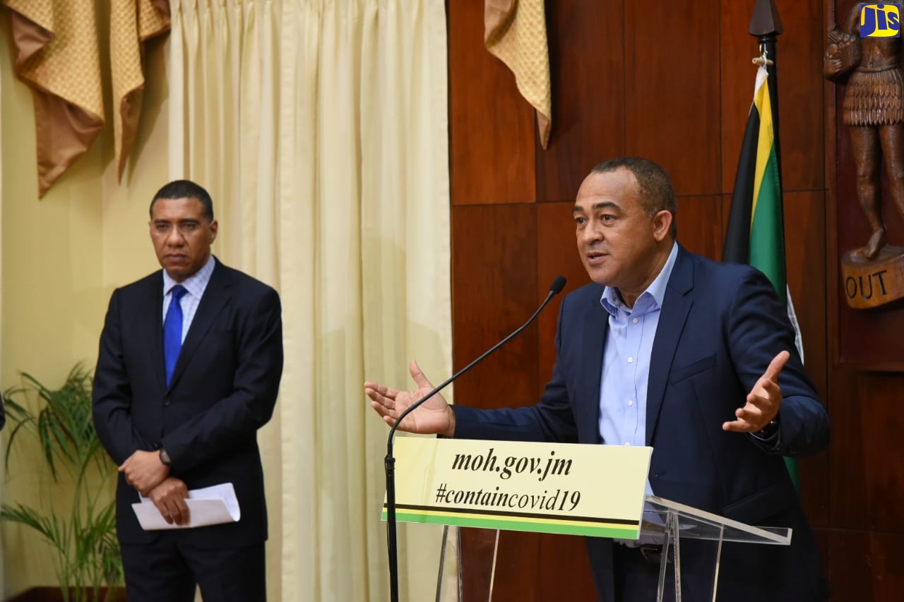 Minister of Health and Wellness, Dr. the Hon. Christopher Tufton (right), emphasises a point at a press conference at Jamaica House, on Monday (March 23). At left is Prime Minister, the Most Hon. Andrew Holness, who also addressed the press conference. 

