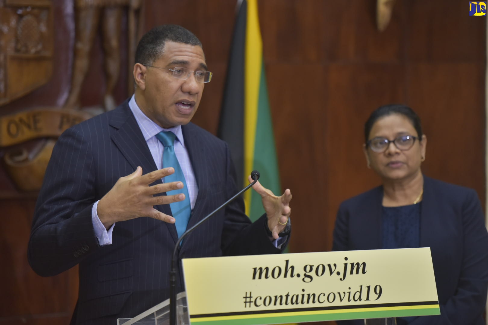 Prime Minister, the Most Hon. Andrew Holness (left), speaks at a press conference at Jamaica House, on Monday (March 30). With the Prime Minister is  Chief Medical Officer, Dr. Jacquiline Bisasor McKenzie.