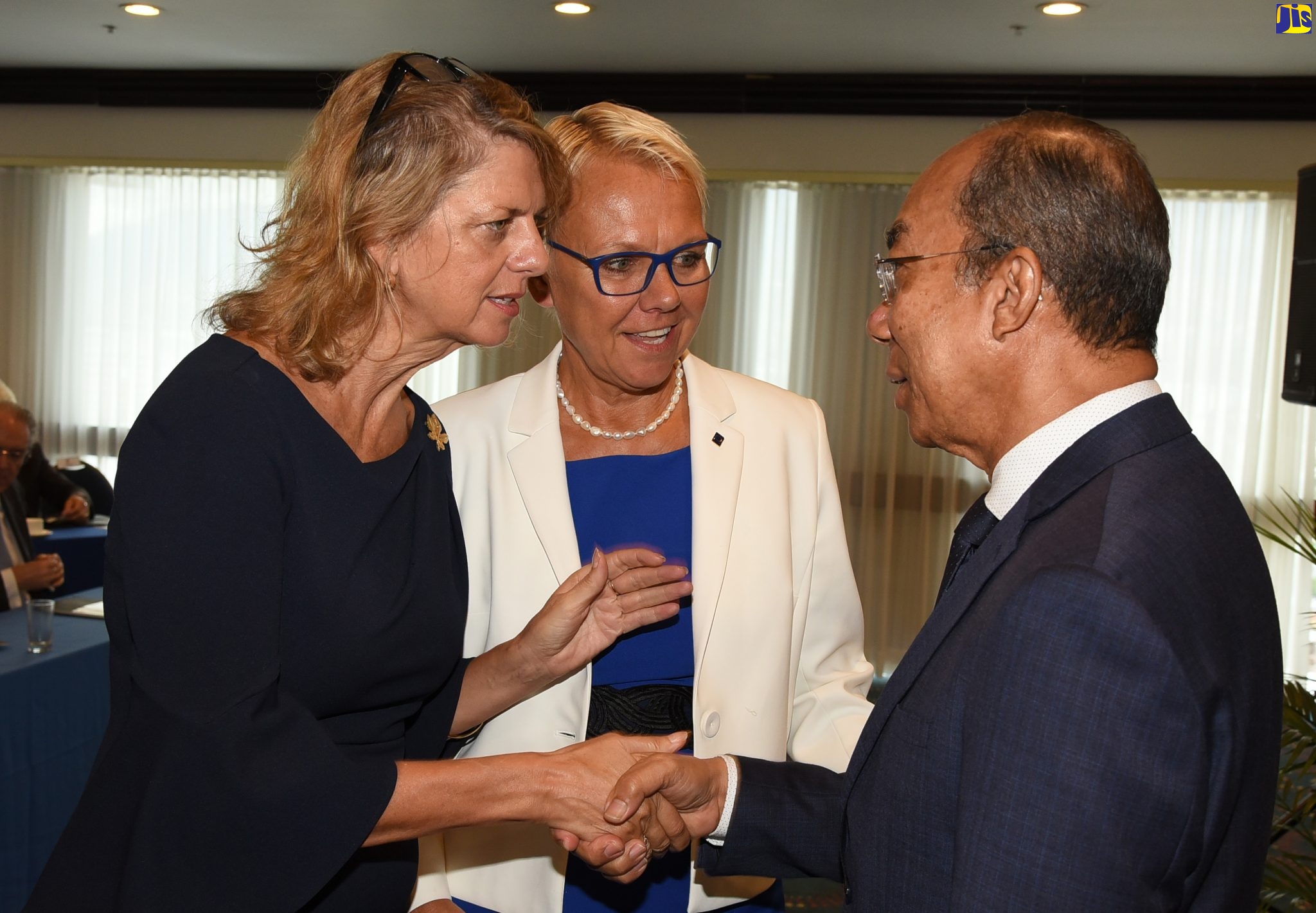 Minister of National Security, Hon. Dr. Horace Chang (right), greets Canadian High Commissioner to Jamaica, Her Excellency Laurie Peters (left), following his address to Heads of Missions, at The Jamaica Pegasus hotel in New Kingston, on March 3, as part of activities for Diplomatic Week 2020. At centre is Head of the European Union (EU) Delegation to Jamaica, Ambassador Malgorzata Wasilewska.