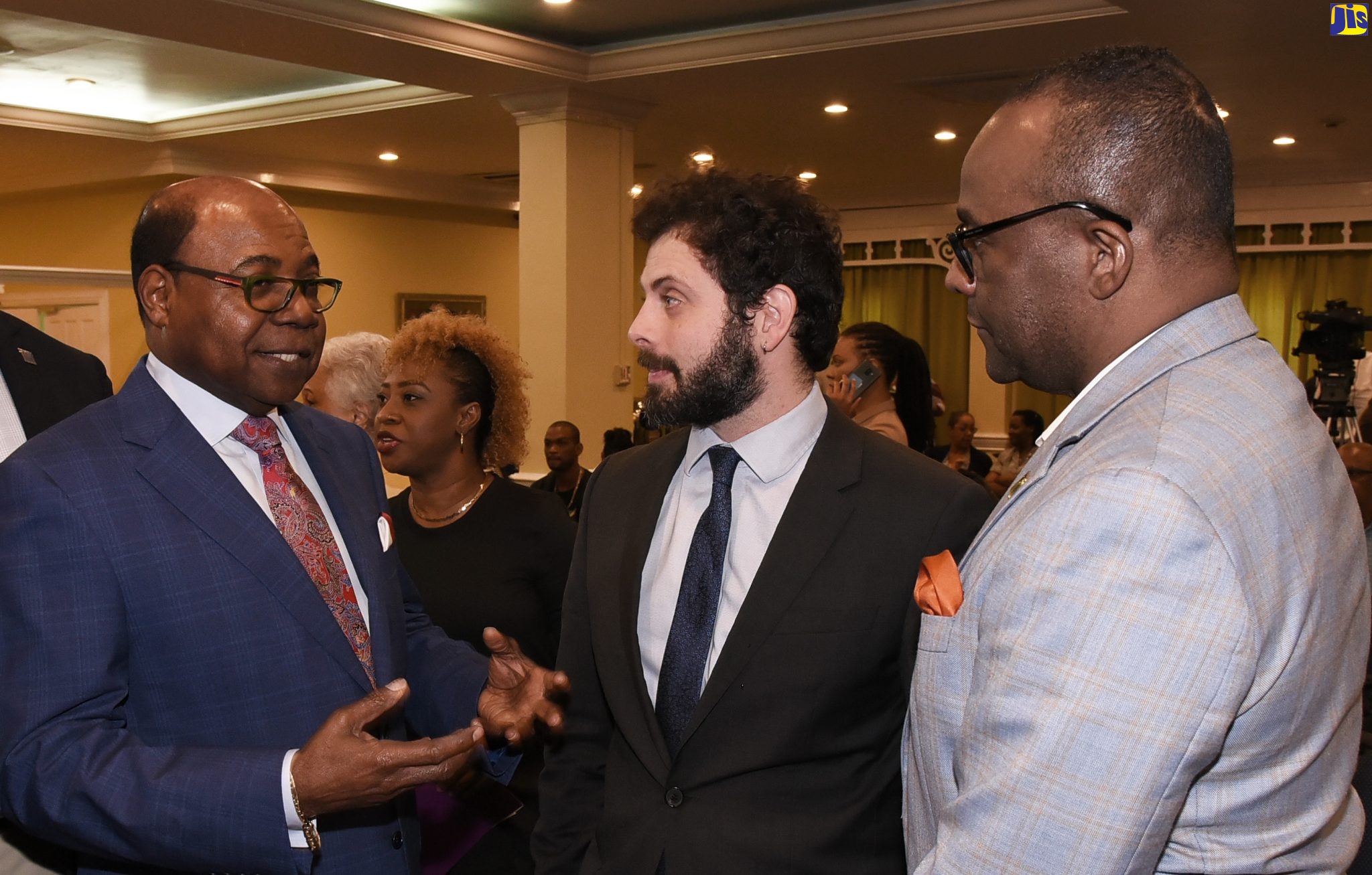 Minister of Tourism, Hon. Edmund Bartlett (left), is in conversation with Assistant Professor of Urban Planning at the Canadian-based University of McGill, David Wachsmutch (centre), and Director of Tourism, Donovan White (left), at a forum dubbed