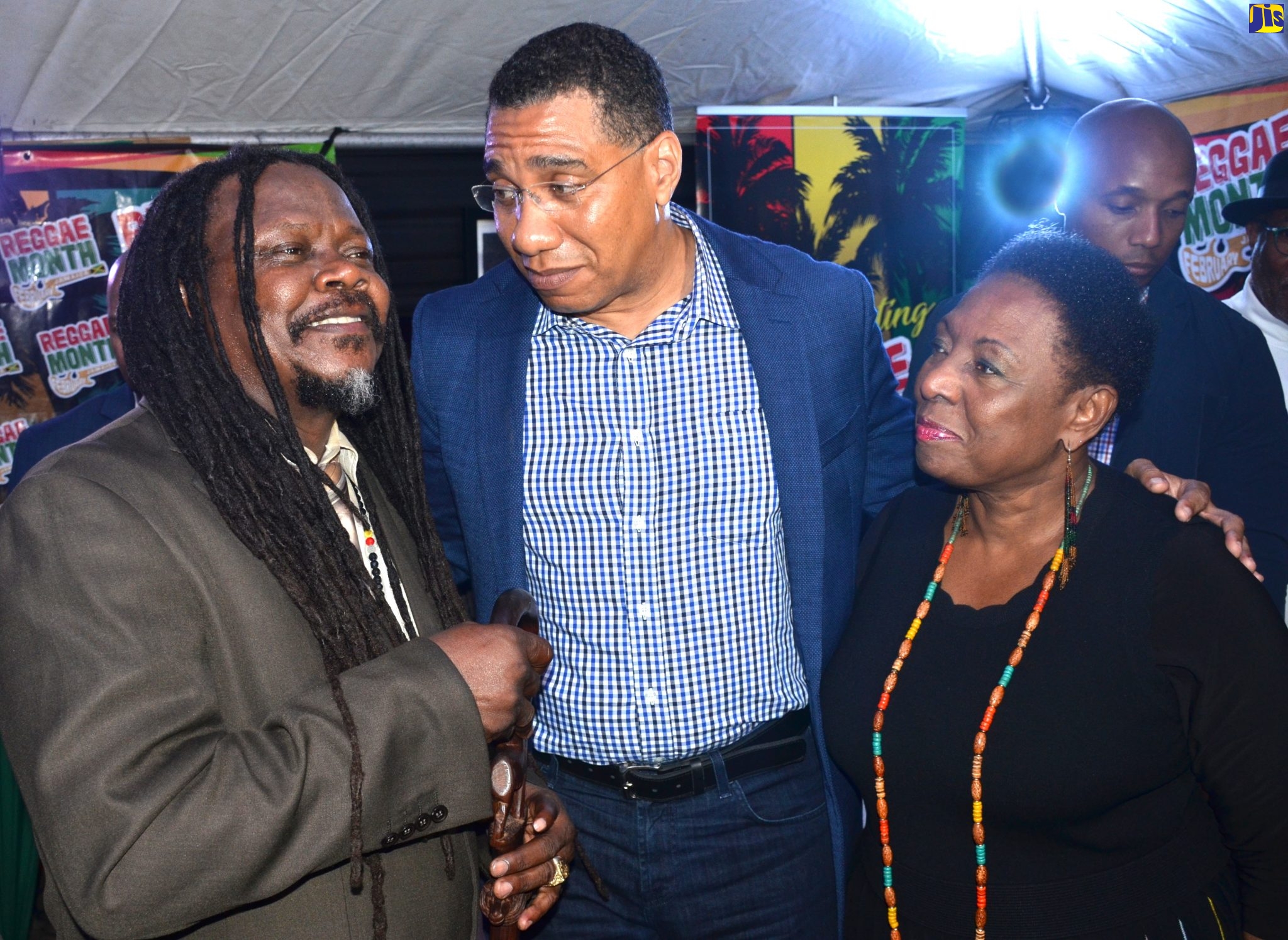Prime Minister, the Most Hon. Andrew Holness (centre), engages in a light moment with (from left), reggae artiste, Luciano; and Minister of Culture, Gender, Entertainment and Sport, Hon. Olivia Grange. Occasion was the staging of the Prime Minister’s Reggae Month Reception at Jamaica House on Sunday (March 1). Luciano was one of the performers during the event.