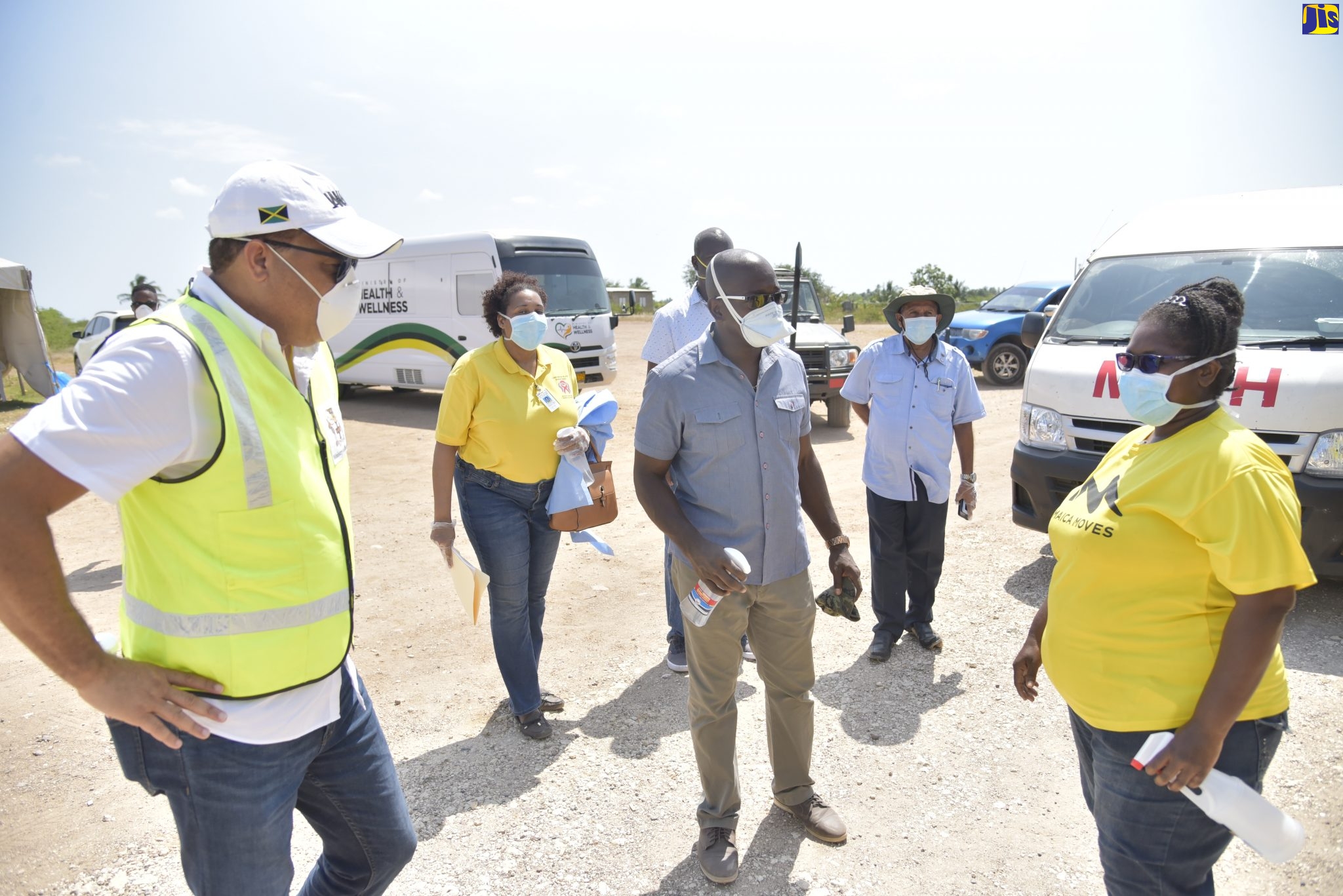 Health and Wellness Minister, Dr. the Hon. Christopher Tufton (left), is in Corn Piece, Clarendon on Monday (April 13), to observe the first deployment of a coronavirus (COVID-19) mobile testing unit to the area. He is joined by Member of Parliament for South East Clarendon, Hon. Pearnel Charles Jr (centre), and personnel from the Ministry.