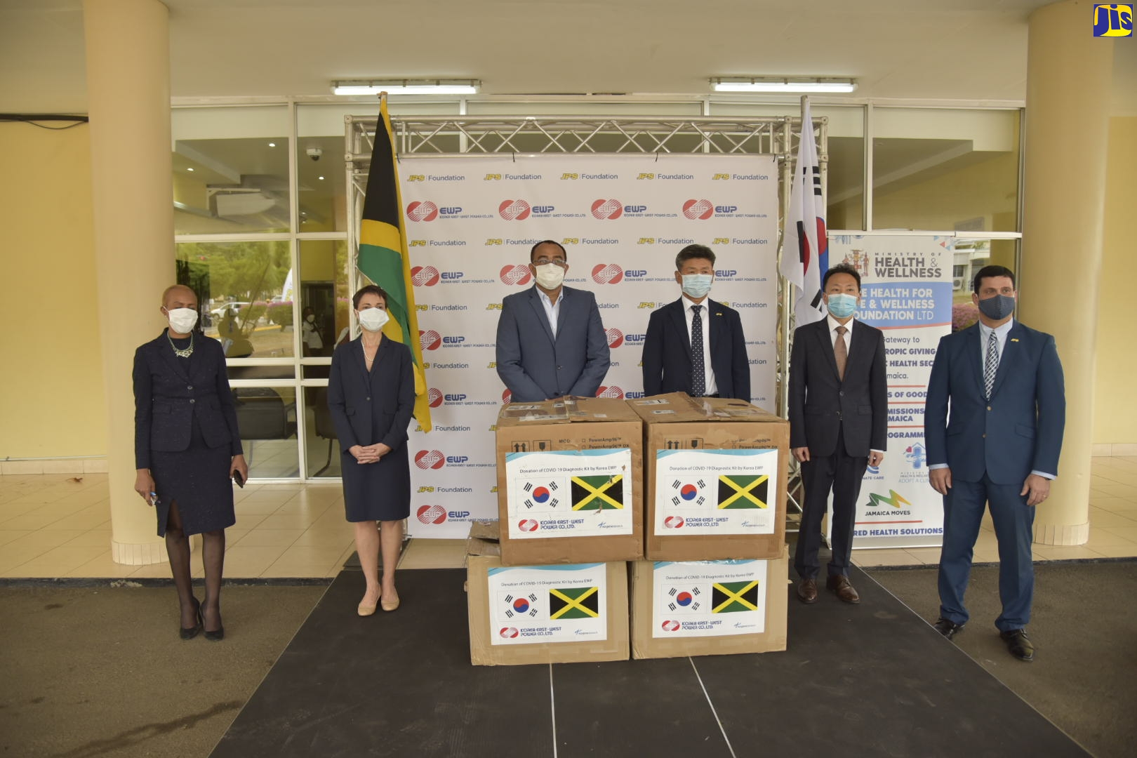 Minister of Health and Wellness, Dr. the Hon. Christopher Tufton (third left), with (from left): Minister of Science, Energy and Technology, Hon. Fayval Williams; Minister of Foreign Affairs and Foreign Trade, Senator the Hon. Kamina Johnson Smith; Jamaica Public Service (JPS) Chairman, Bokhoa Jeong; and Charge d’Affaires, Embassy of the Republic of Korea, Baejin Lim, at the handover of testing kits valued at US$200,000 by Jamaica Public Service shareholder, Korea East West Power, to the Government of Jamaica, to assist in the national fight against COVID-19. The ceremony was held on April 27 at the Department of Microbiology, at the University Hospital of the West Indies.