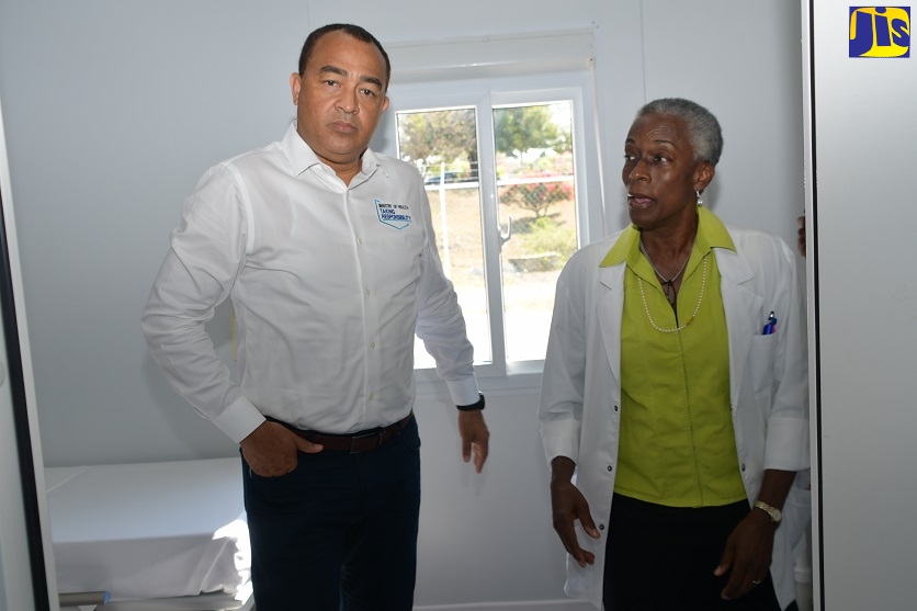 Minister of Health and Wellness, Dr. the Hon. Christopher Tufton (left), is taken on a tour of the new isolation ward at the Cornwall Regional Hospital, in St. James, by Chairperson of the Infection Control Committee at the hospital, Dr. Barbara Salmon - Grandison , on Thursday (April 9).