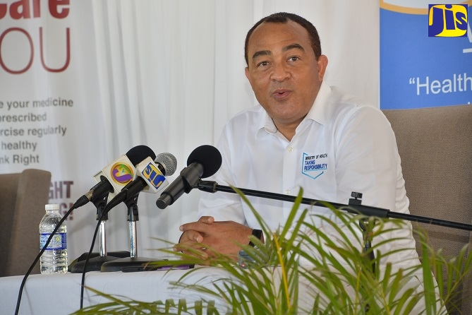 Minister of Health and Wellness , Dr. the Hon. Christopher Tufton, addresses a press briefing at the Sandals Inn in Montego Bay, St. James, recently.