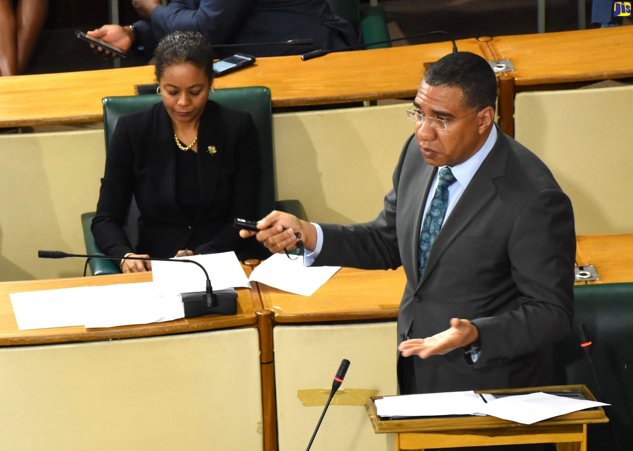 Prime Minister, the Most Hon. Andrew Holness, addresses a sitting of the House of Representatives on April 15.  Seated behind him is Attorney General, Hon. Marlene Malahoo Forte.