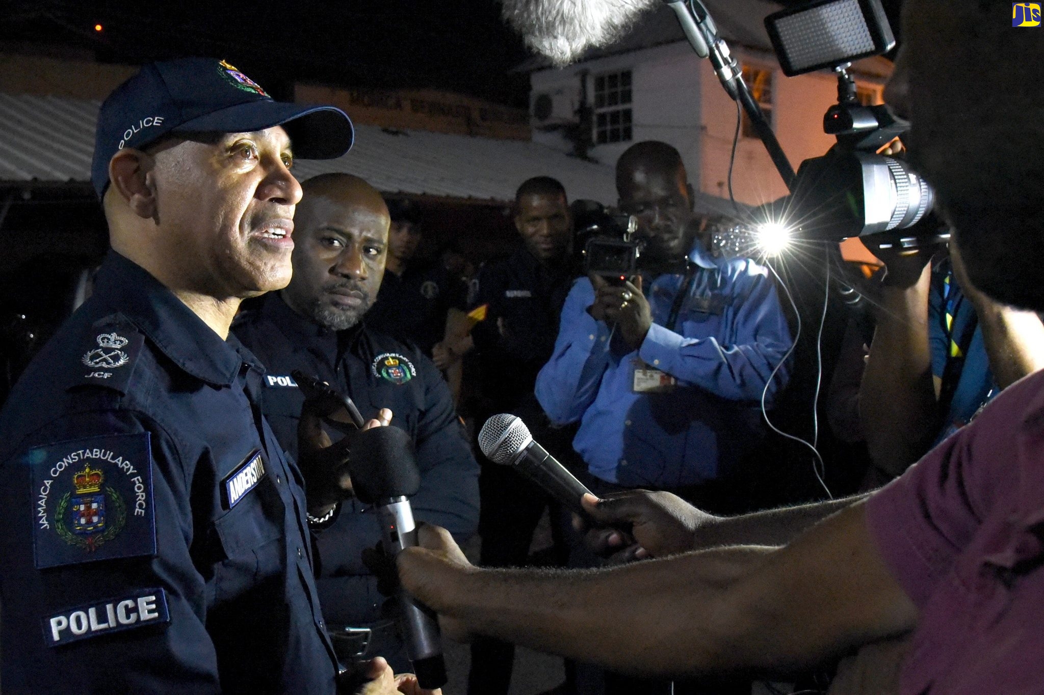 Police Commissioner, Major General Antony Anderson (left), speaks with journalists on Wednesday (April 1), after visiting sections of the Corporate Area to view activities under the all-island seven-day curfew, now in effect, to slow down the spread of the coronavirus (COVID-19). The curfew, which has been imposed by the Government, will run from April 1 to 8 between 8:00 p.m. and 6:00 a.m.