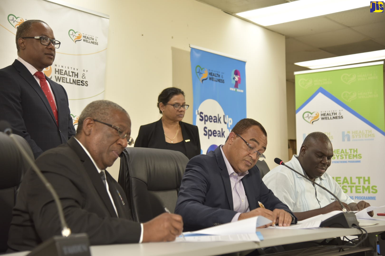 Minister of Health and Wellness, Dr. the Hon. Christopher Tufton (second right), signs a memorandum of understanding (MOU) with Principal of the University of the West Indies (UWI), Professor Dale Webber (second left); and Campus Registrar, Dr. Donovan Stanberry (right), on April 7, which will provide for final year medical students to man the Ministry