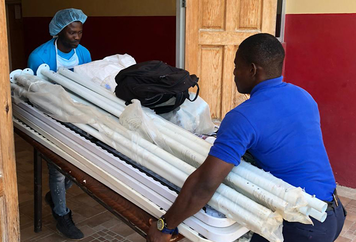 Firefighters from the Santa Cruz Fire Station in St. Elizabeth, Junior Smith (left) and Akeva Graham,  at work on Labour Day (Monday, May 25).​