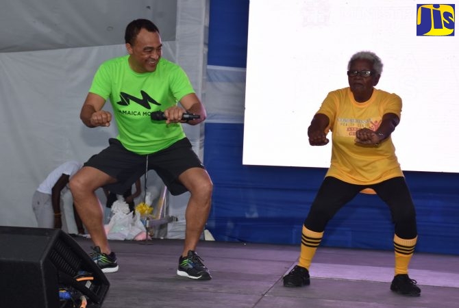 Minister of Health and Wellness, Dr. the Hon Christopher Tufton; and senior citizen, Gwendolyn Morgan, from the Comprehensive Health Centre