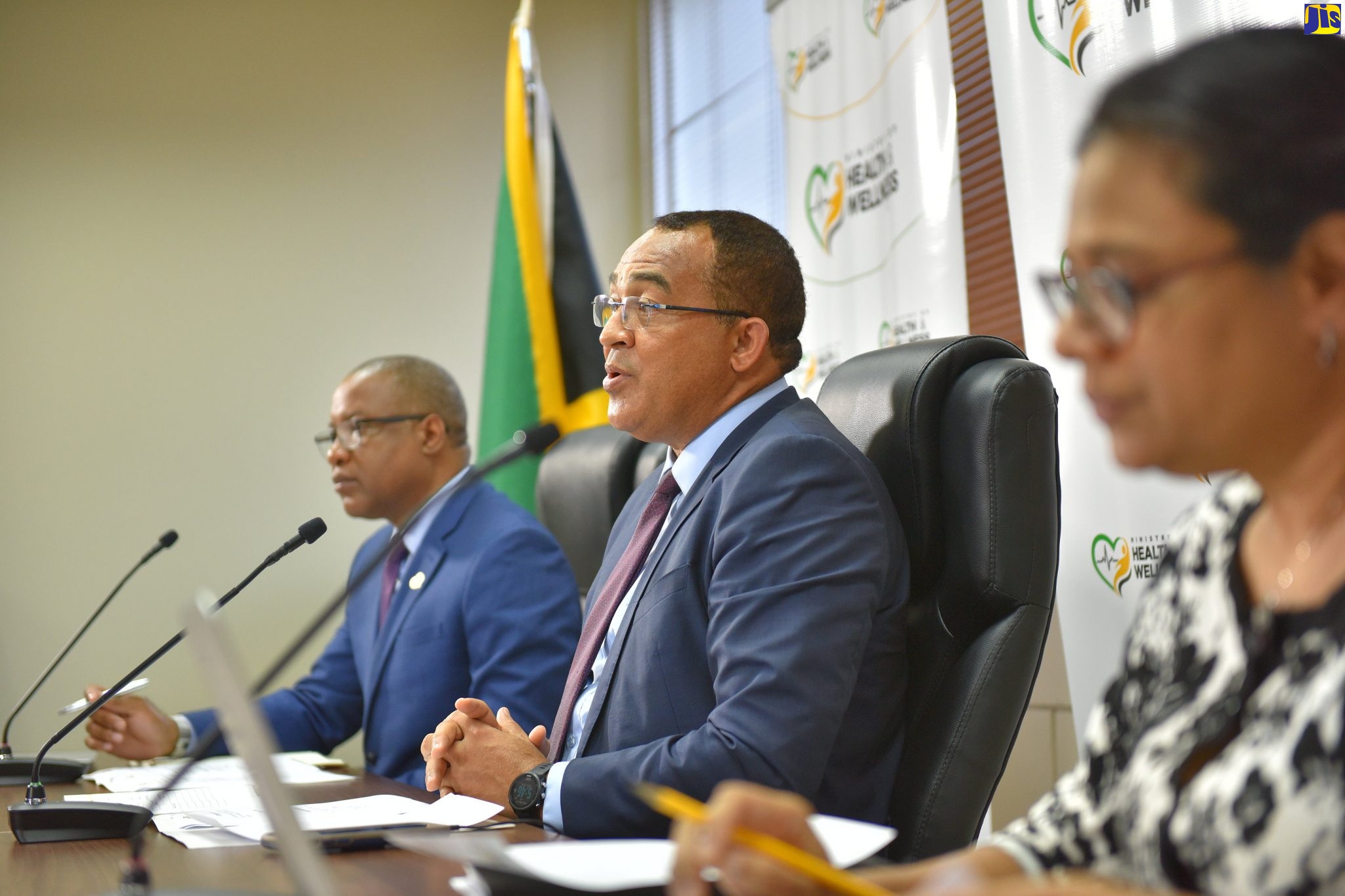 Minister of Health and Wellness, Dr. the Hon. Christopher Tufton (centre), speaks at a digital press conference at the Ministry on Wednesday (May 13). With the Minister are Permanent Secretary, Ministry of Health and Wellness, Dunstan Bryan; and Chief Medical Officer, Dr. Jacquiline Bisasor McKenzie.