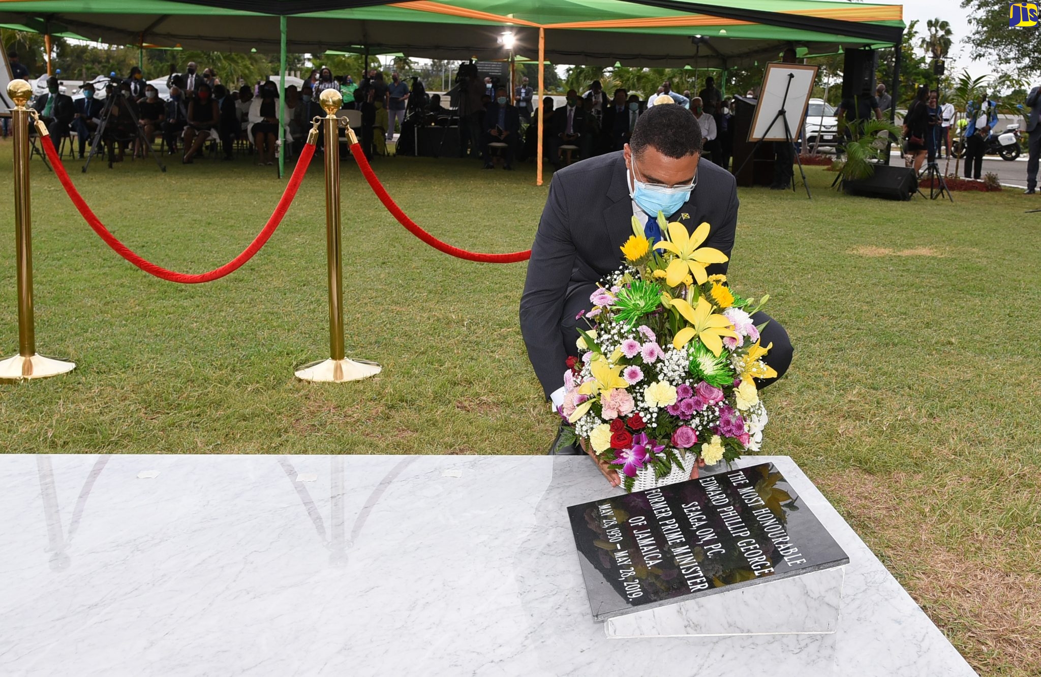 Prime Minister, the Most Hon. Andrew Holness, lays a floral tribute at the grave of former Prime Minister, the Most Hon. Edward Seaga, during a ceremony held on Thursday (May 28) at National Heroes Park in Kingston to mark the life and work of the late statesman. The fifth Prime Minister of Jamaica, Edward Seaga held the office for two successive terms from 1980 to 1989 and was leader of the Jamaica Labour Party (JLP) from 1974 until his retirement in 2005.  Mr. Seaga was elected Member of Parliament for Western Kingston in April, 1962 and held the seat for 40 consecutive years. Mr. Seaga died on his 89th birthday on May 28, 2019.