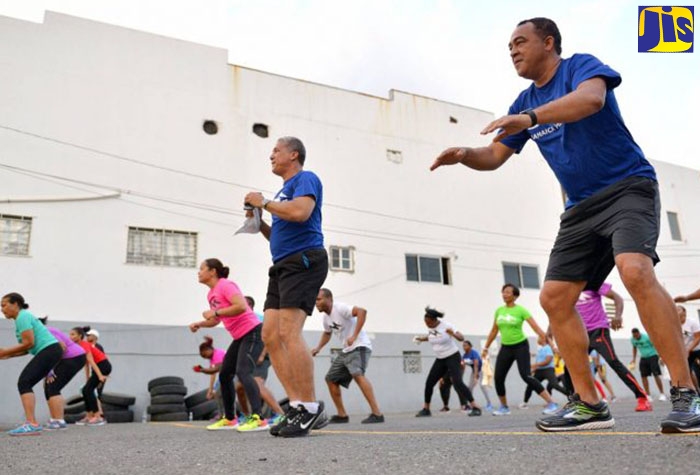 Minister of Health and Wellness, Dr. Hon Christopher Tufton, participates in an exercise session at the National Baking Company's  Half-Way Tree Road offices in Kingston.

