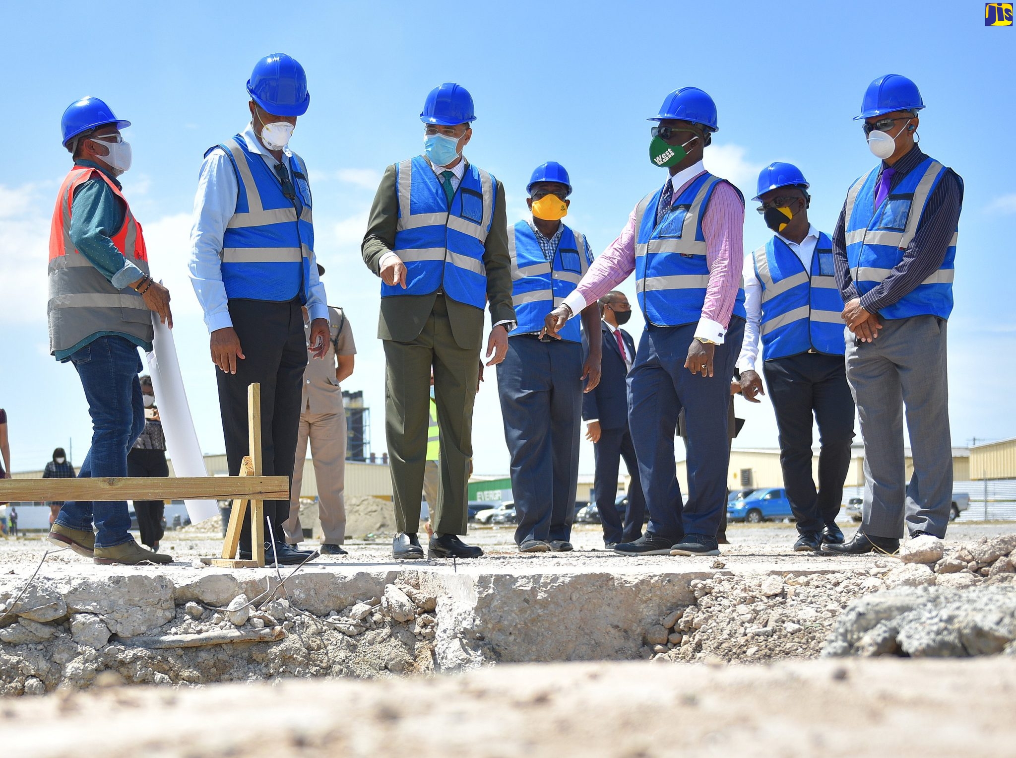 Prime Minister, the Most Hon. Andrew Holness (third left), views work being carried out under the Factories Corporation of Jamaica