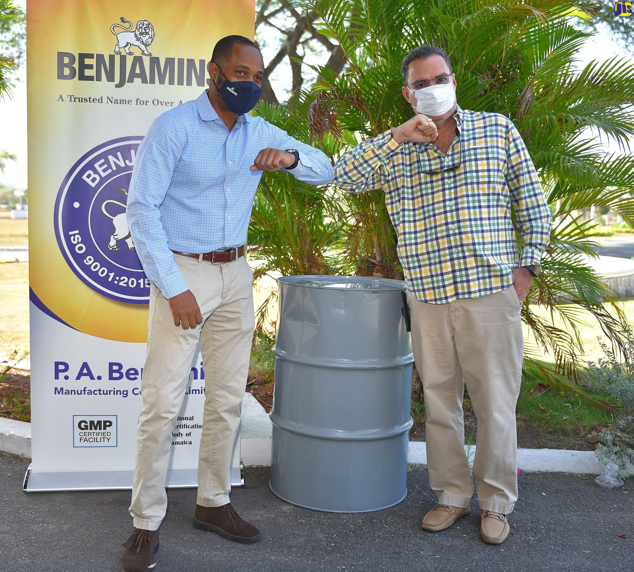 Minister without Portfolio in the Ministry of Economic Growth and Job Creation, Hon. Daryl Vaz (right), greets P.A. Benjamin Manufacturing Company Limited