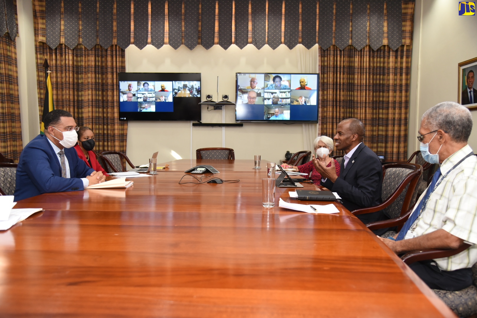 Prime Minister, the Most Hon. Andrew Holness (left), in discussion with  President, Jamaica Chamber of Commerce, Lloyd Distant (second right), during the National Consensus on Crime stakeholder meeting at the Office of the Prime Minister in St. Andrew, on June 25. Others taking part (from second left) are Attorney General, Marlene Malahoo Forte;  Chairman of the Violence Prevention Alliance (VPA), Dr. Elizabeth Ward;  and Professor of Political Sociology, University of the West Indies, Anthony Harriott.