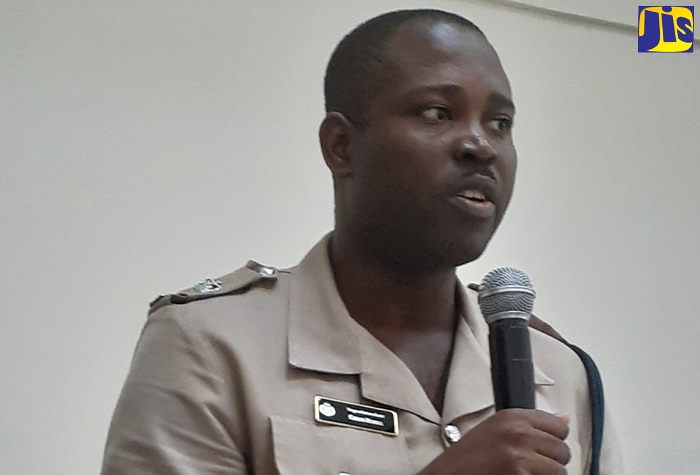 Superintendent of Police in charge of Operations in Westmoreland, Carlos Russell, addresses the monthly meeting of the Westmoreland Municipal Corporation, in  Savanna-la -Mar, on June 11.