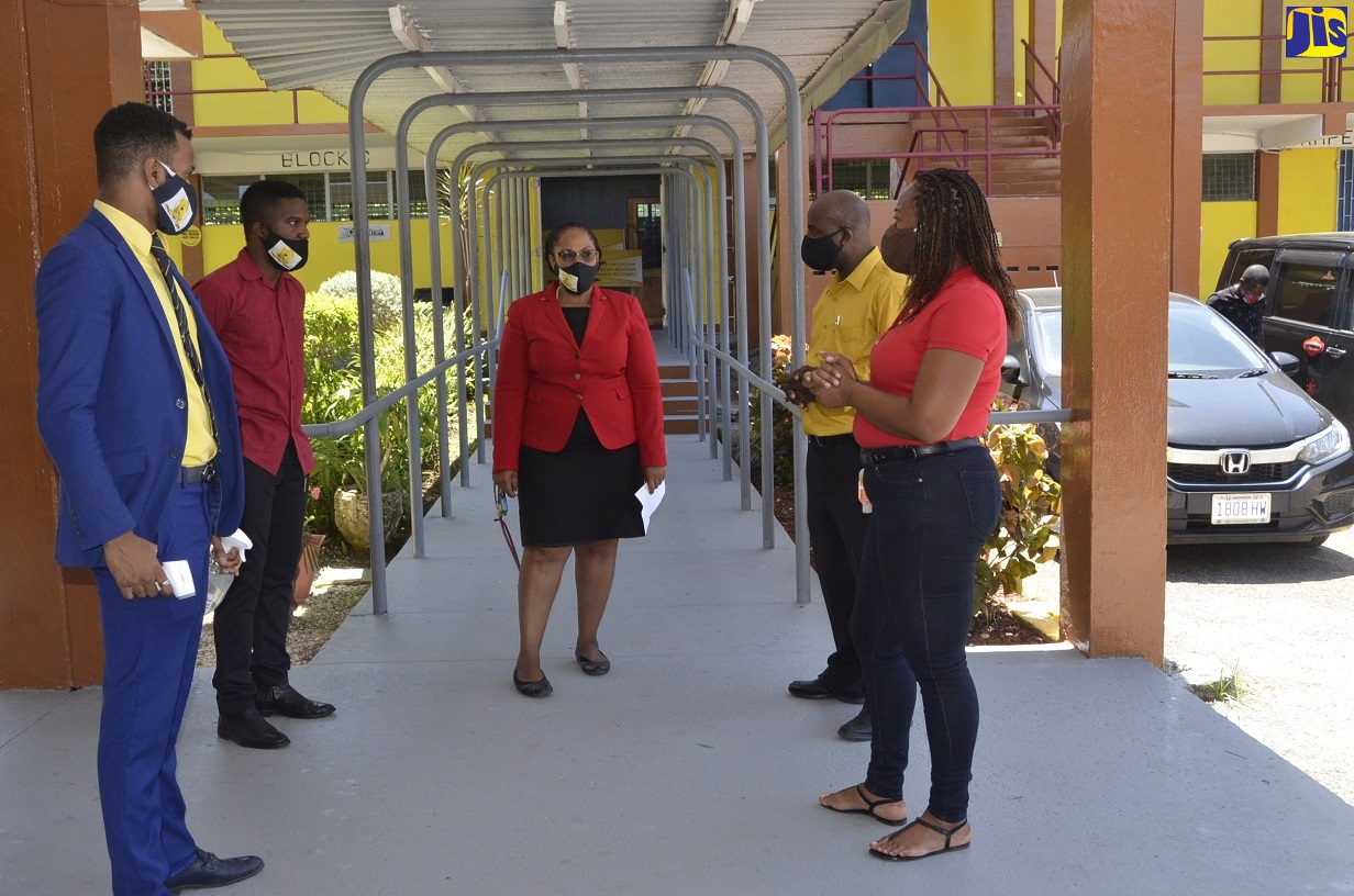 Principal of Anchovy High School in St. James, Lavern Stewart ( centre ), in discussion with (from left) Deans of Discipline, Levon Brissett and Ishba Higgins; President of the Anchovy High Past Students’ Association, Albert Ferguson and President of the school’s Parent-Teachers Association (PTA), Sygana Ricketts, on day one of the resumption of classes, on Monday (June 8), for students sitting the Caribbean Secondary Education Certificate (CSEC) and Caribbean Advanced Proficiency Examination (CAPE).