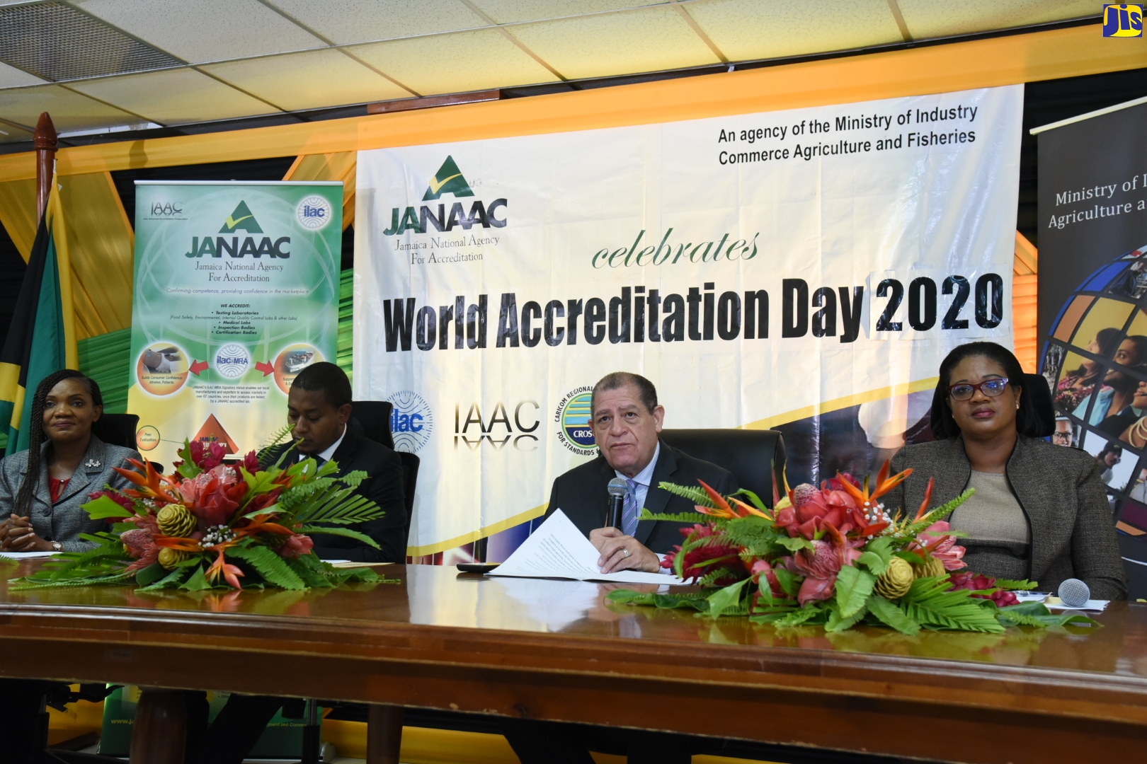 Minister of Industry, Commerce, Agriculture and Fisheries, Hon. Audley Shaw (third left), addresses the World Accreditation Day virtual commemorative ceremony on Tuesday (June 9). Also pictured (from left) are Chief Executive Officer, Jamaica National Agency for Accreditation (JANAAC), Sharonmae Shirley; State Minister in the Ministry of Industry, Commerce, Agriculture and Fisheries, Hon. Floyd Green; and Acting Chief Technical Director in the Industry Ministry, Michelle Parkins.