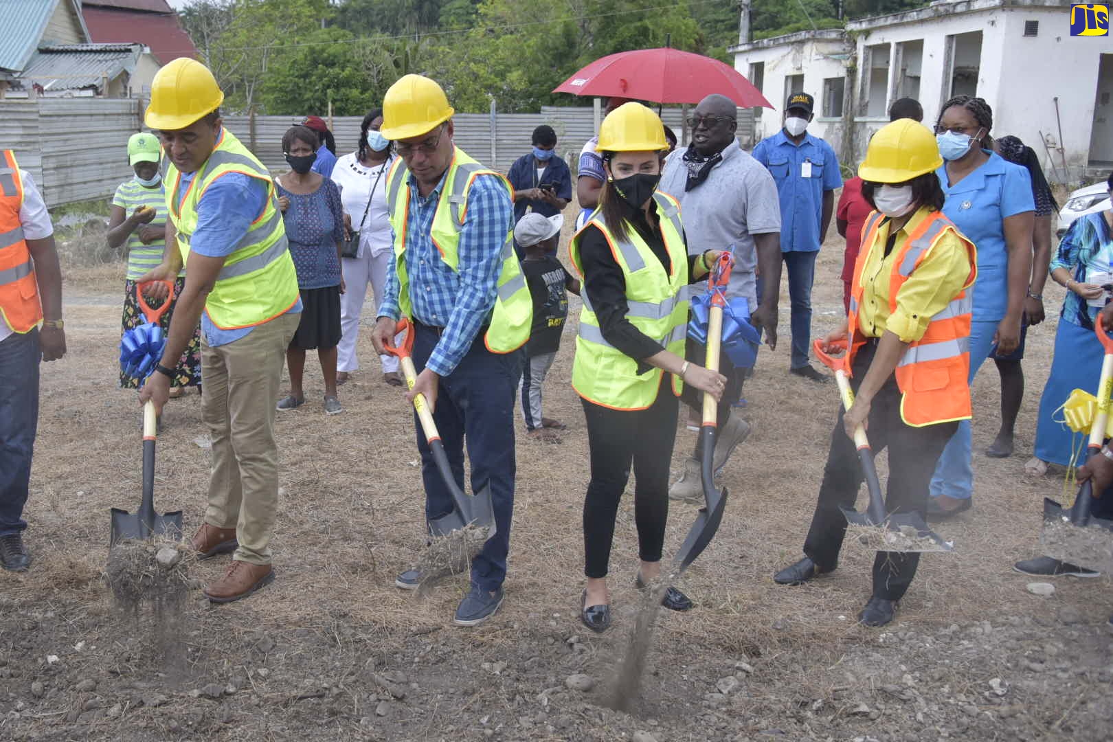 Minister of Health and Wellness, Dr. the Hon. Christopher Tufton (left), participates in the breaking of ground for the construction of the $200 million, Buff Bay Health Centre, in Portland, on June 12. Others (from 2nd left) are: Member of Parliament for West Portland and Minister without portfolio in the Ministry of Economic Growth and Job Creation, Hon. Daryl Vaz; Member of Parliament for Eastern Portland, Ann-Marie Vaz; and Health Promotion and Public Relations Manager at the National Health Fund (NHF), Shermaine Robotham.