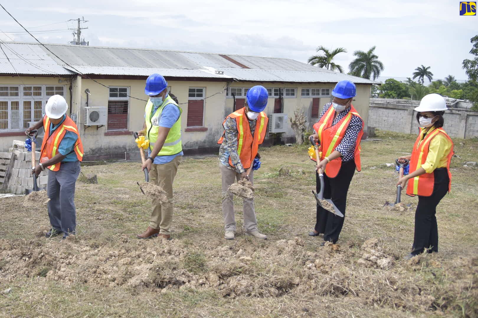 Minister of Health and Wellness, Dr. the Hon. Christopher Tufton (second left), breaks ground for the $180-million expansion of the Annotto Bay Hospital in St. Mary, on June 12.  Also participating are (from left): Managing Director of Otiga Engineers, Douglas Bowes; Member of Parliament for South East St. Mary, Dr. Norman Dunn; Regional Director with the Ministry, Fabia Lamm; and Health Promotion and Public Relations Manager at the National Health Fund (NHF), Shermaine Robotham.