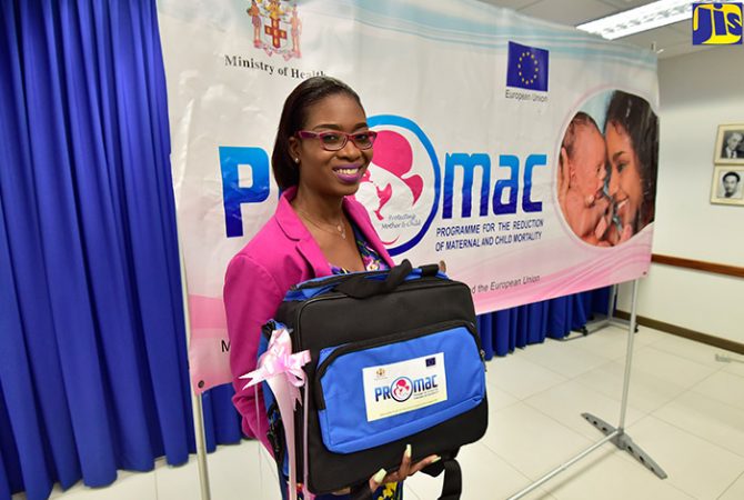 Director of Health Promotion and Protection in the Ministry of Health and Wellness and Coordinator for the Programme for the Reduction of Maternal and Child Mortality (PROMAC), Dr. Simone Spence, displays a midwife bag to be used in primary healthcare facilities. 