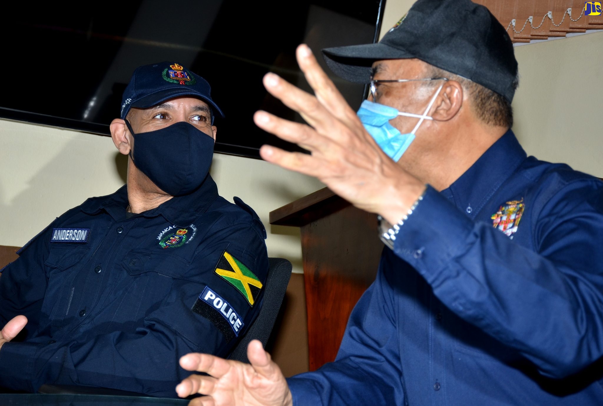 Minister of National Security, Hon. Dr. Horace Chang (second right) is being briefed by Superintendent Maldria Jones-Williams (second left) during a tour of the Central  Police Station in Kingston on Saturday (June 6). Also listening are Minister without Portfolio in the Ministry of National Security, Hon. Matthew Samuda (left) and Commissioner of Police, Major General Antony Anderson.