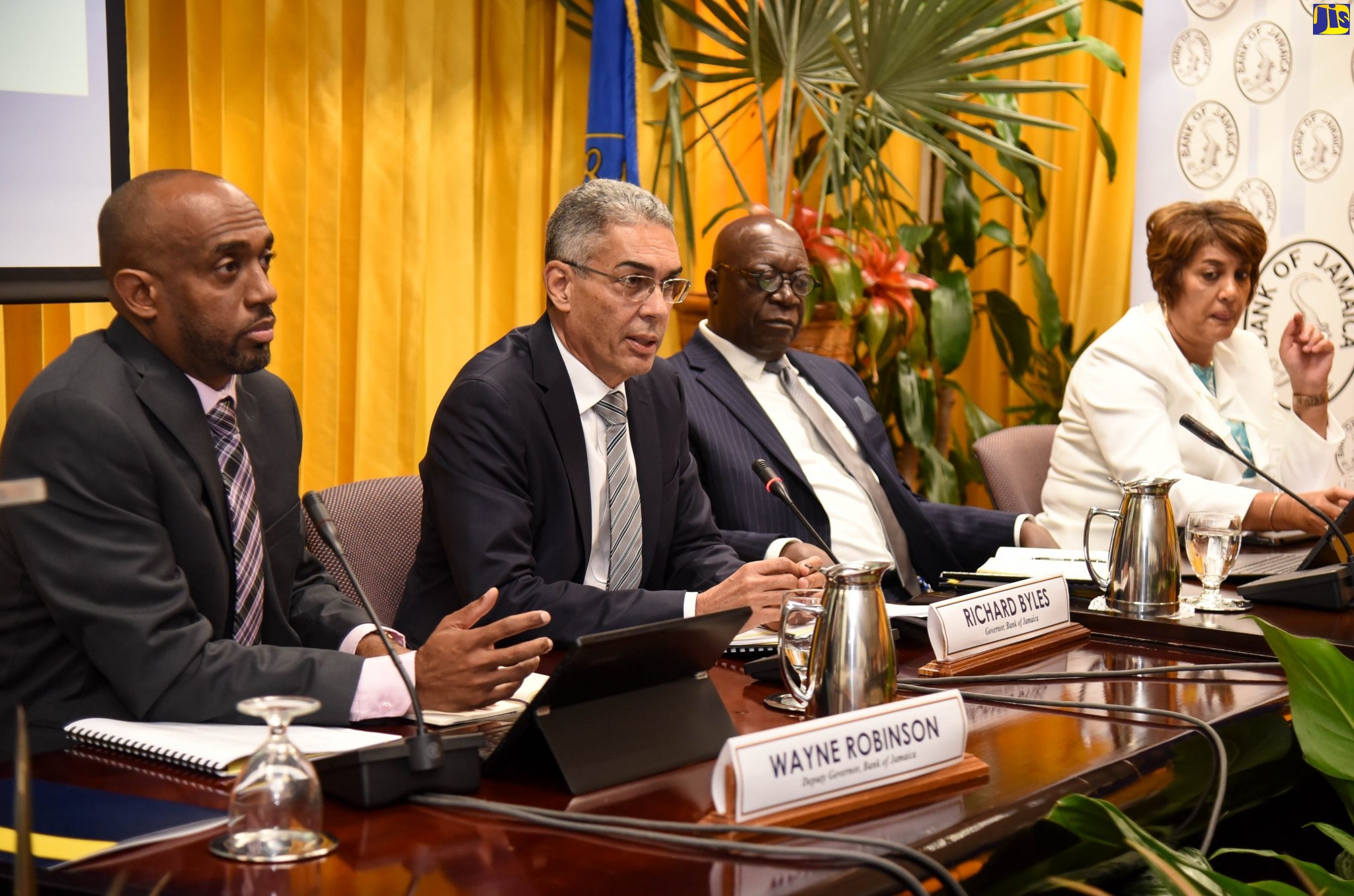 Bank of Jamaica (BOJ) Governor, Richard Byles (second left), addresses journalists during a quarterly media briefing at the BOJ in downtown Kingston. Others (from left) are Deputy Governor, Research and Economic Programming Division and Financial Stability, Dr. Wayne Robinson; Senior Deputy Governor, John Robinson; and Deputy Governor, Banking, Currency Operations and Financial Markets Infrastructure, Natalie Haynes.