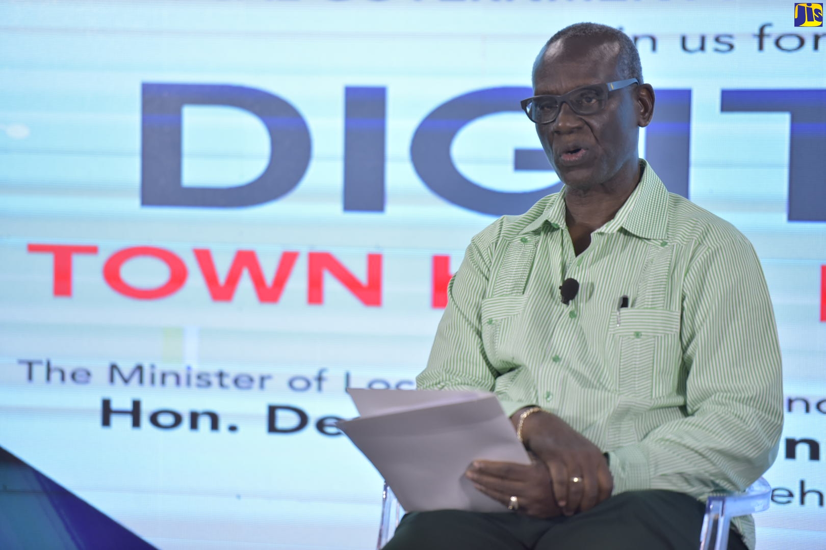 Minister of Local Government and Community Development, Hon. Desmond McKenzie, speaking at a recent digital town hall hosted by the Ministry.