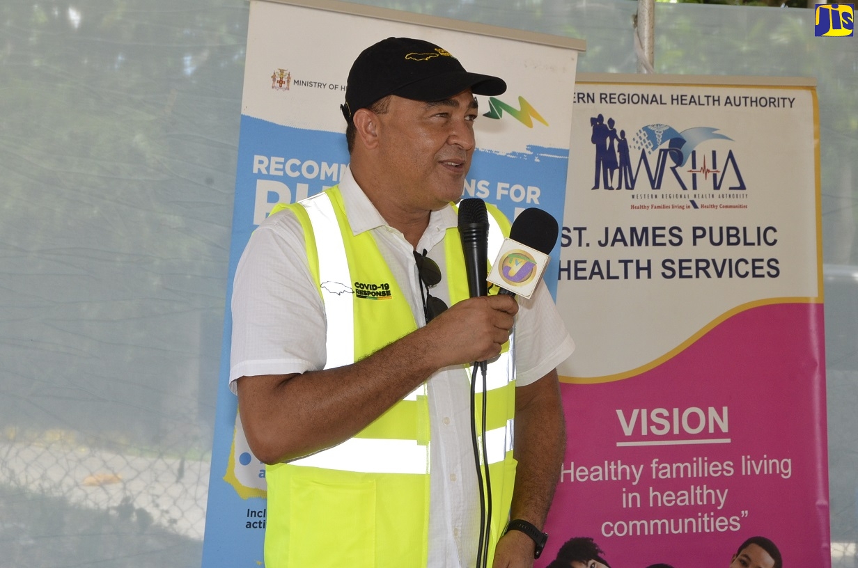 Minister of Health and Wellness, Dr. the Hon. Christopher Tufton addresses health care workers at the Norwood Basic School in Montego Bay, St. James on Friday (July 10) prior to a coronavirus (COVID-19) sensitization walk in the community.