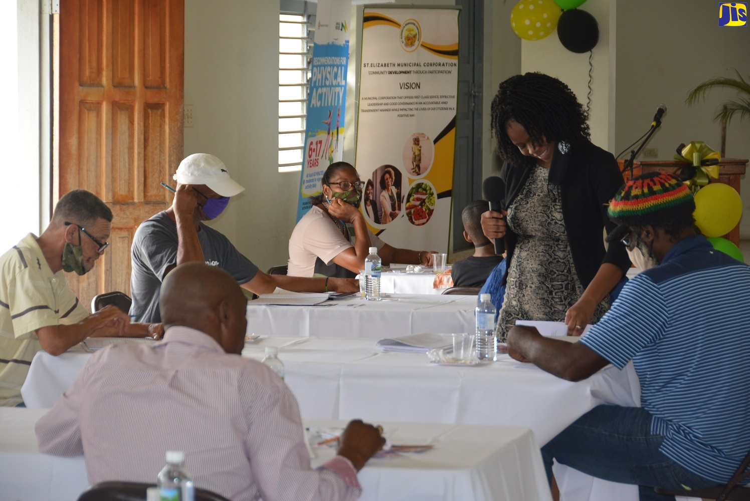 Shelter Managers being assisted by Southern Regional Coordinator for the Office of Disaster Preparedness and Emergency Management (ODPEM), Camille Beckford Palmer (right), during a recent Shelter Management Training exercise, held at the St. Matthew's Anglican Church in Santa Cruz, St. Elizabeth.