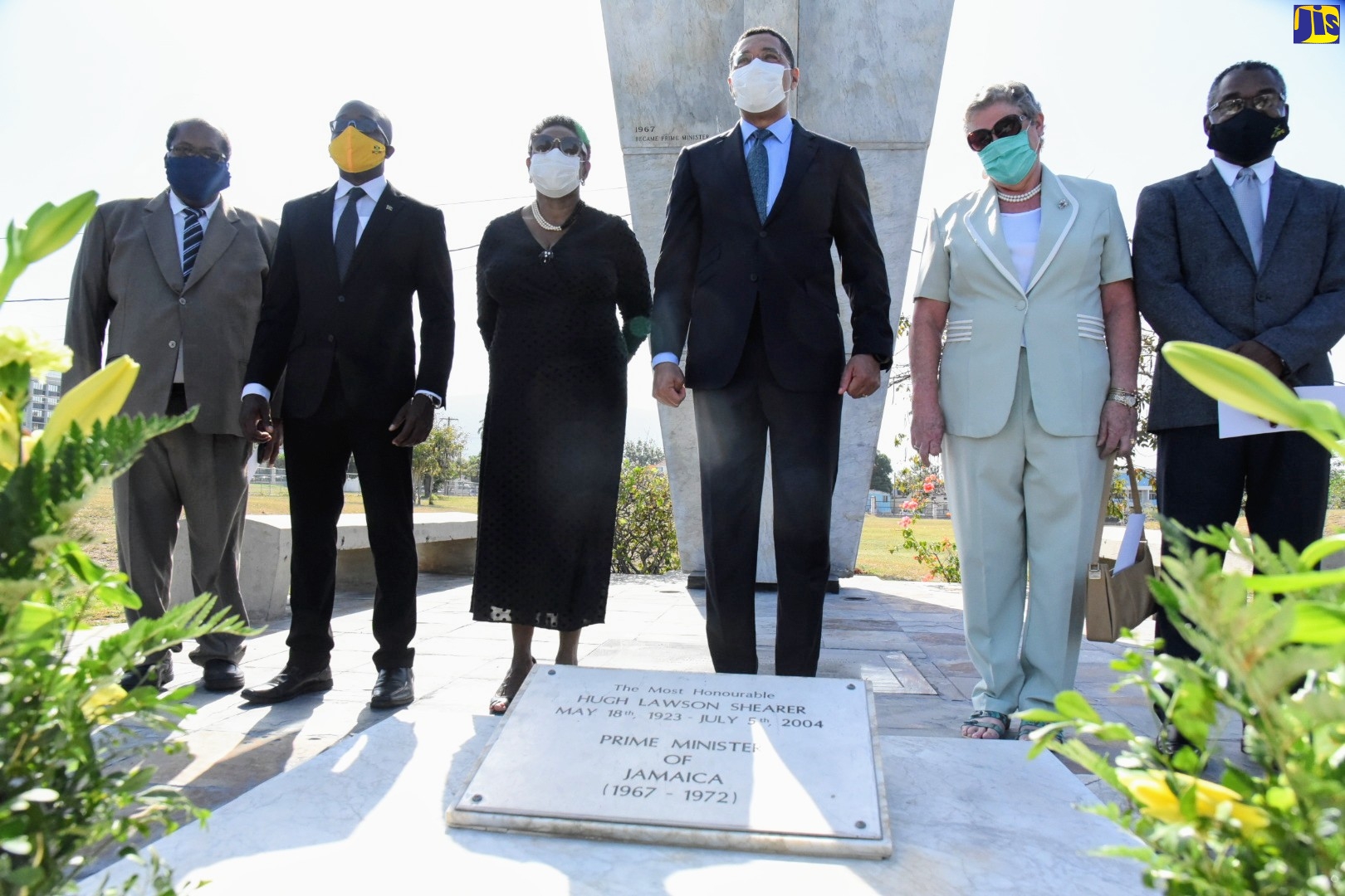 Prime Minister, the Most Hon. Andrew Holness (third right) is pictured with (from left), Senator Lambert Brown; Member of Parliament for South East Clarendon, Pearnel Charles Jr.; Minister of Culture, Gender, Entertainment and Sport, Hon. Olivia Grange; Dr. Denise Eldemire-Shearer, widow of late former Prime Minister, the Most Hon. Hugh Shearer; and President, Bustamante Industrial Trade Union( BITU), Senator Kavan Gayle. Occasion was  a floral tribute to commemorate the 97th anniversary of the birth of Mr. Shearer, at National Heroes Park, Kingston, recently.