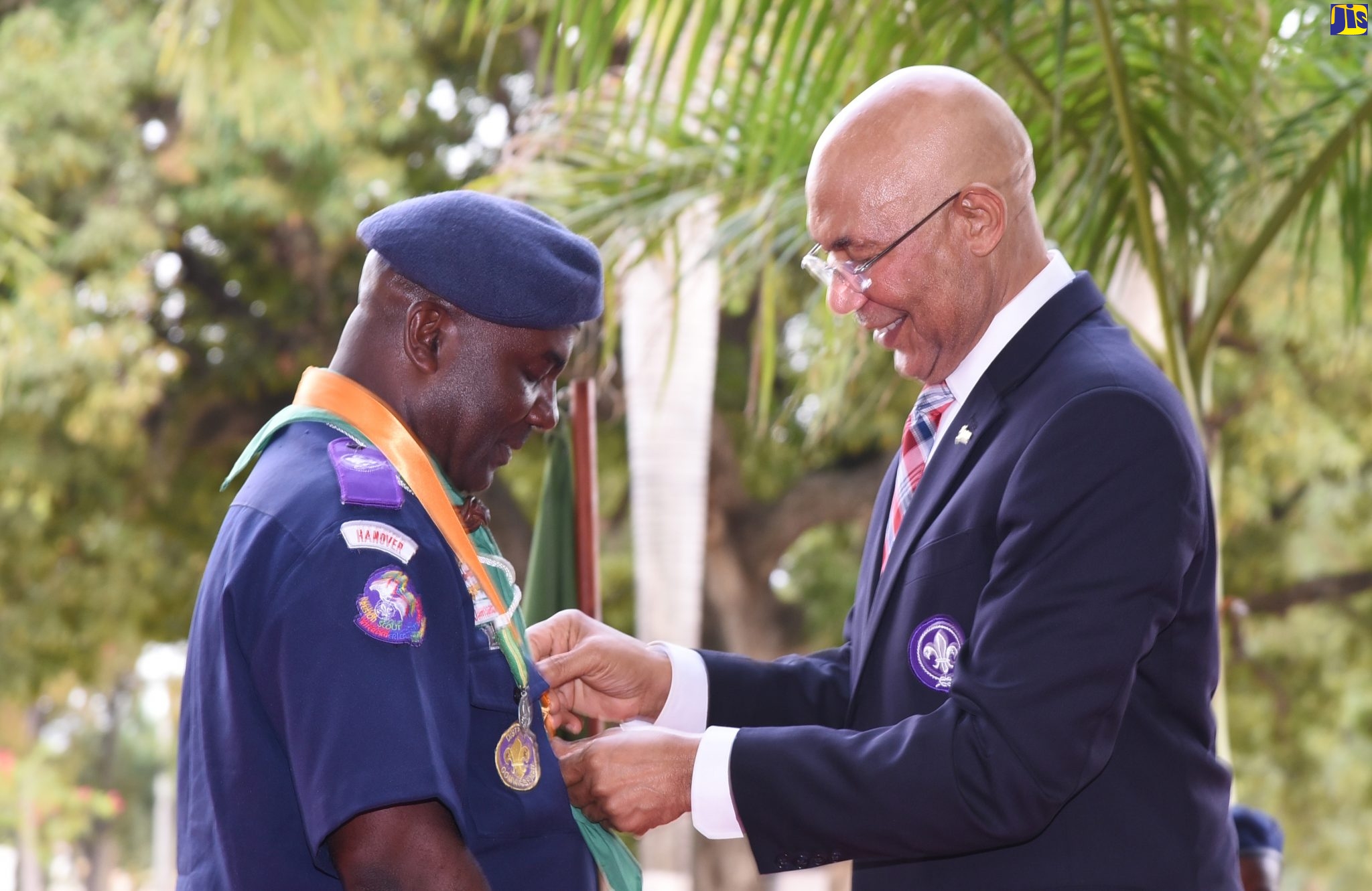 Governor-General, His Excellency the Most Hon. Sir Patrick Allen (right), presents the Silver Pineapple Award for distinguished service to Scout Association of Jamaica Regional Coordinator and District Commissioner for Hanover, Albert Ferguson, during the club’s public meeting and awards ceremony held recently at King